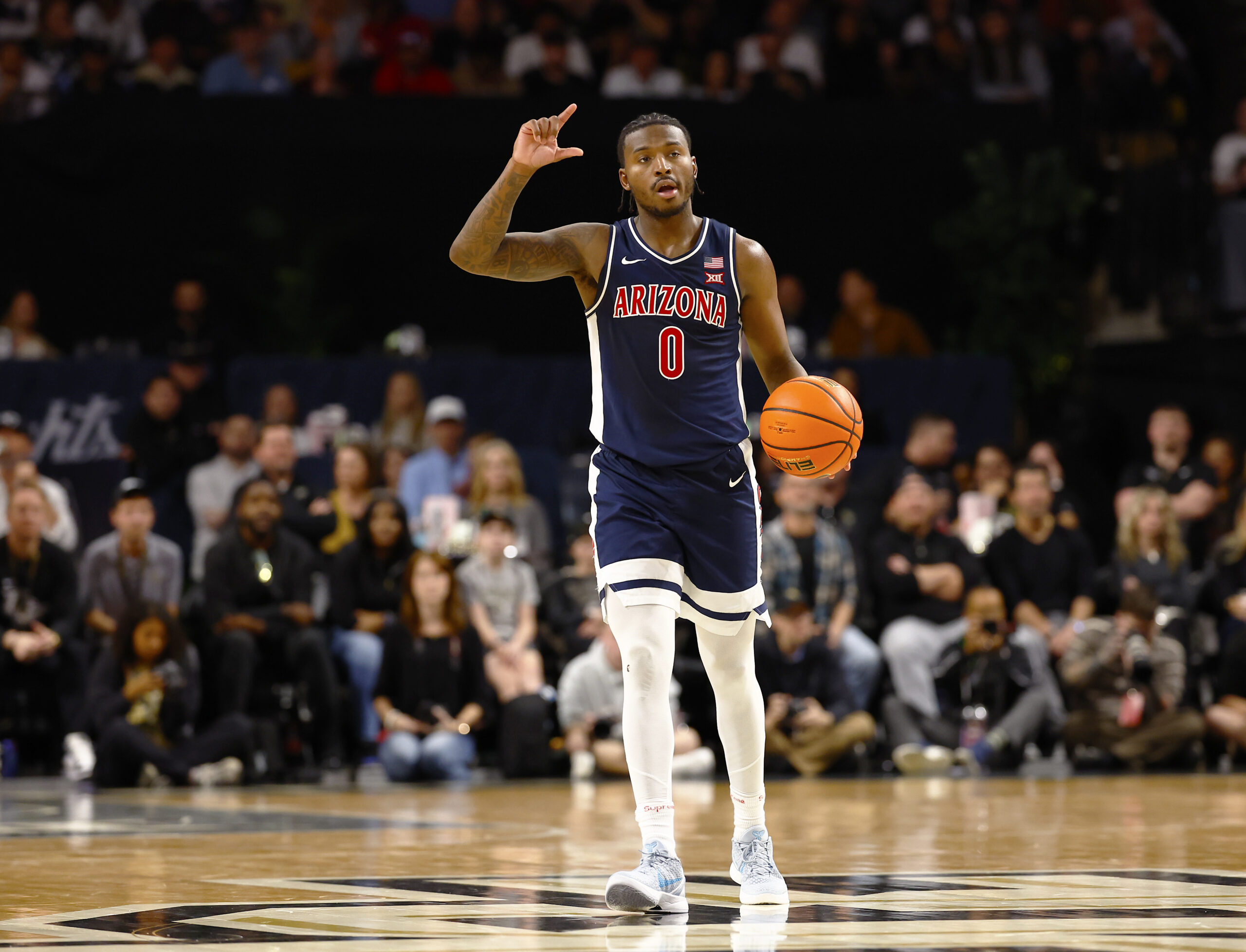 Jan 17, 2026; Orlando, Florida, USA;  Arizona Wildcats guard Jaden Bradley (0) calls a play during the second half against the Central Florida Knights at Addition Financial Arena. Mandatory Credit: Russell Lansford-Imagn Images