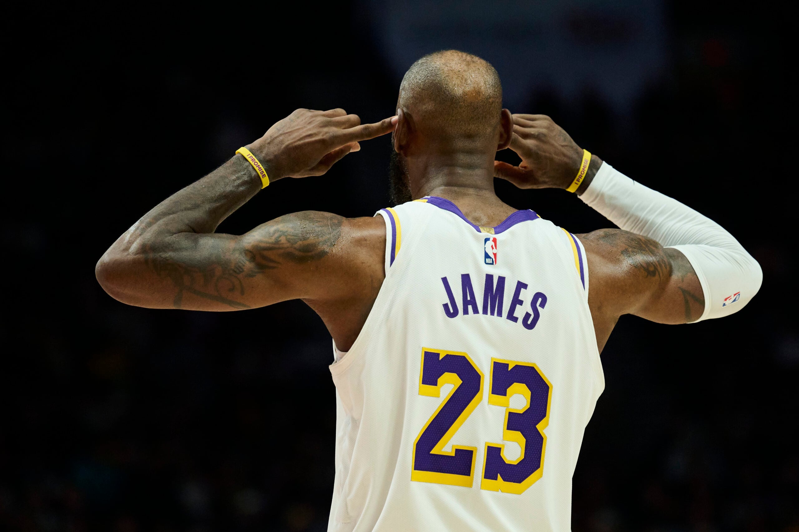 Jan 17, 2026; Portland, Oregon, USA; Los Angeles Lakers forward LeBron James (23) cups his ears as he looks to the coach for a play call during the second half against the Portland Trail Blazers at Moda Center. Mandatory Credit: Troy Wayrynen-Imagn Images