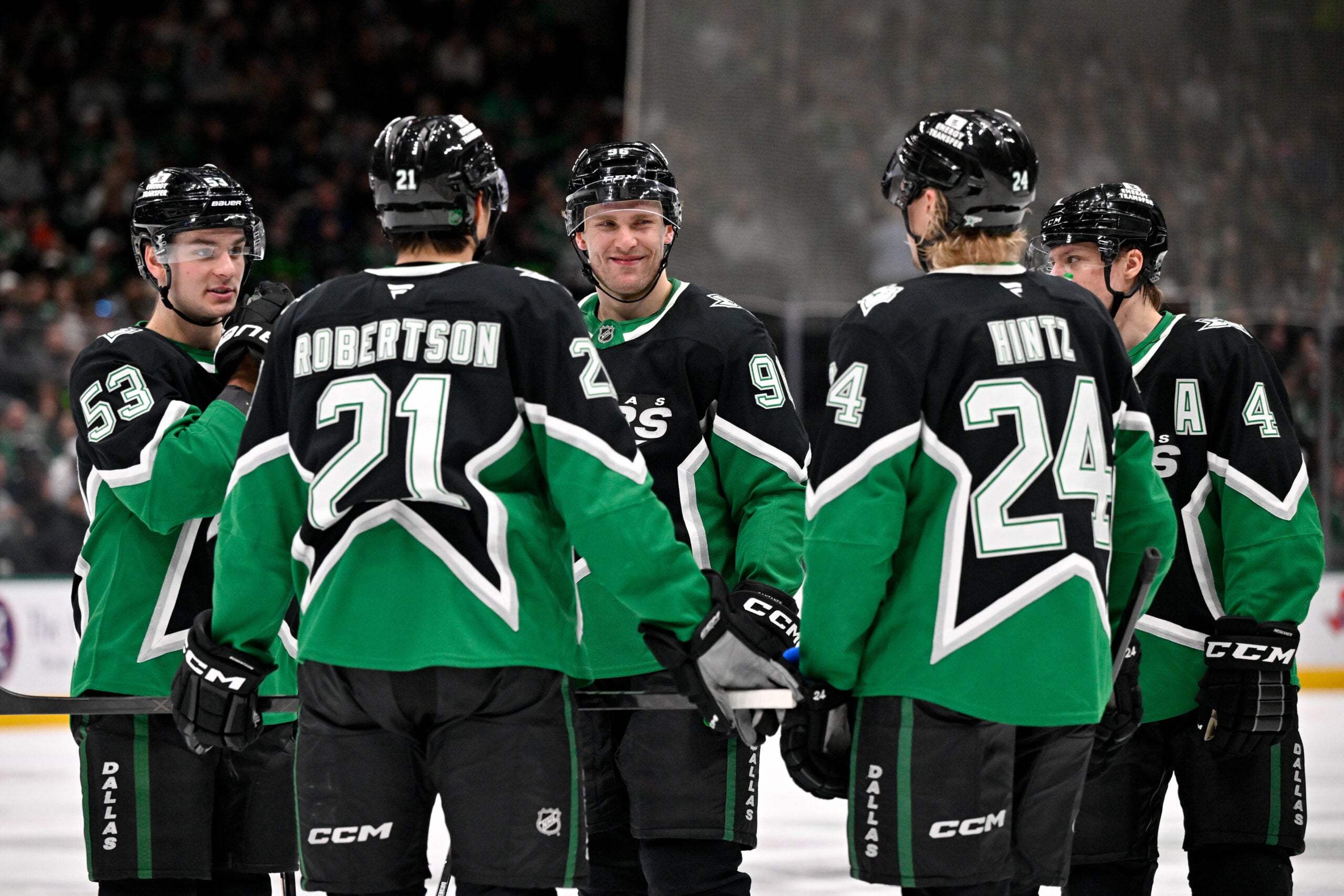 Jan 18, 2026; Dallas, Texas, USA; Dallas Stars center Wyatt Johnston (53) and left wing Jason Robertson (21) and right wing Mikko Rantanen (96) and center Roope Hintz (24) and defenseman Miro Heiskanen (4) huddle before a power play against the Tampa Bay Lightning during the second period at the American Airlines Center. Mandatory Credit: Jerome Miron-Imagn Images