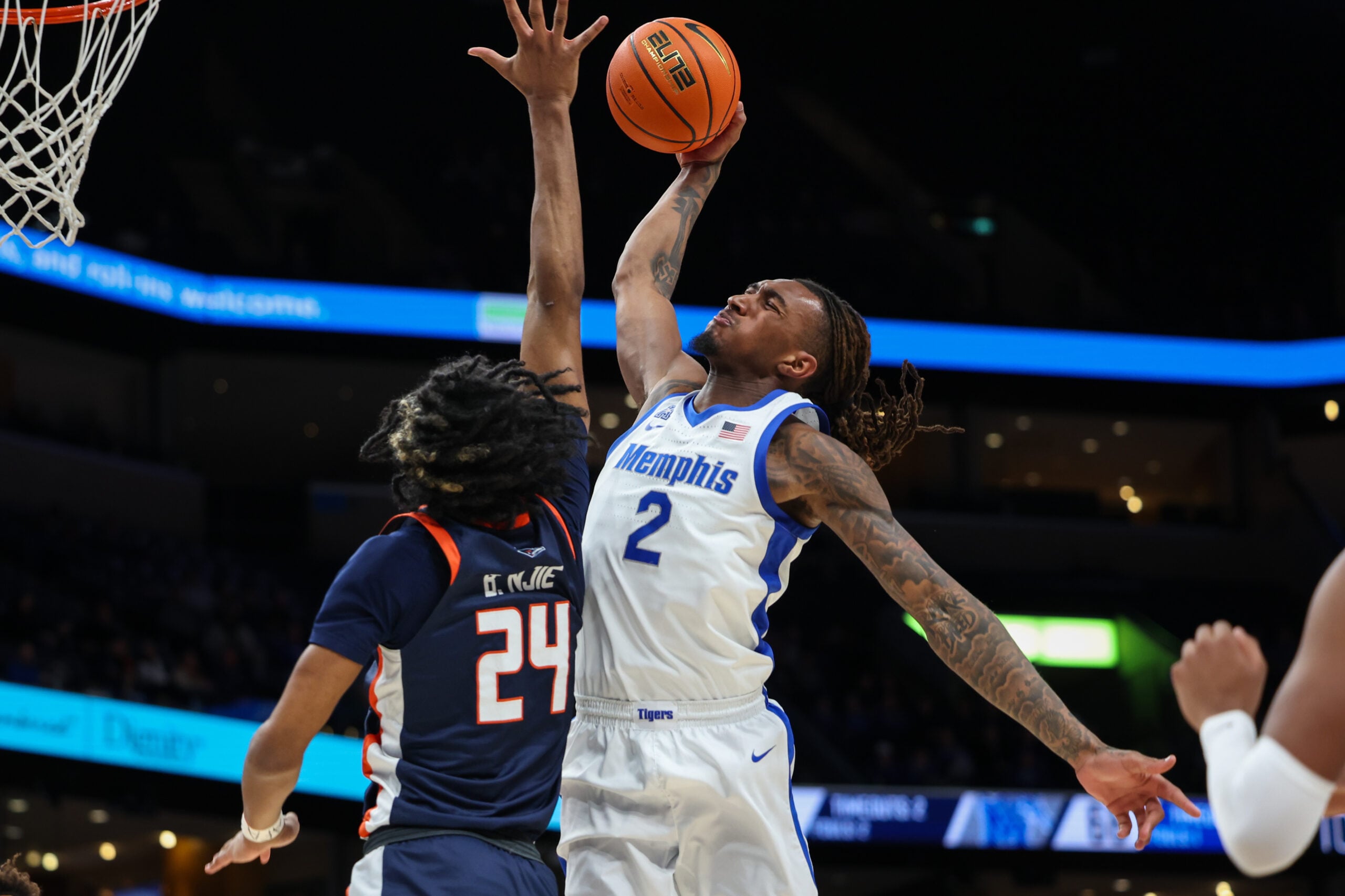 Jan 18, 2026; Memphis, Tennessee, USA; Memphis Tigers guard Zach Davis (2) dunks against UTSA Roadrunners guard Baboucarr Njie (24) during the second half at FedExForum. Mandatory Credit: Wesley Hale-Imagn Images