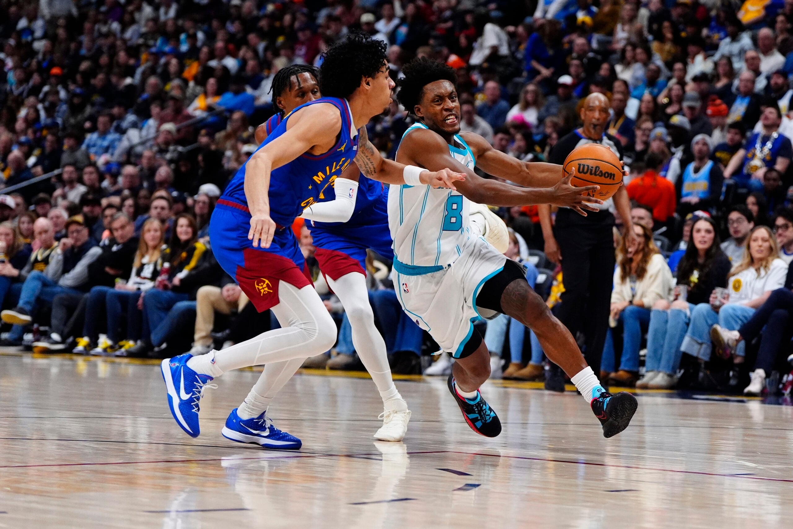 Jan 18, 2026; Denver, Colorado, USA; Denver Nuggets guard Julian Strawther (3) defends Charlotte Hornets guard Collin Sexton (8) in the second quarter at Ball Arena. Mandatory Credit: Ron Chenoy-Imagn Images
