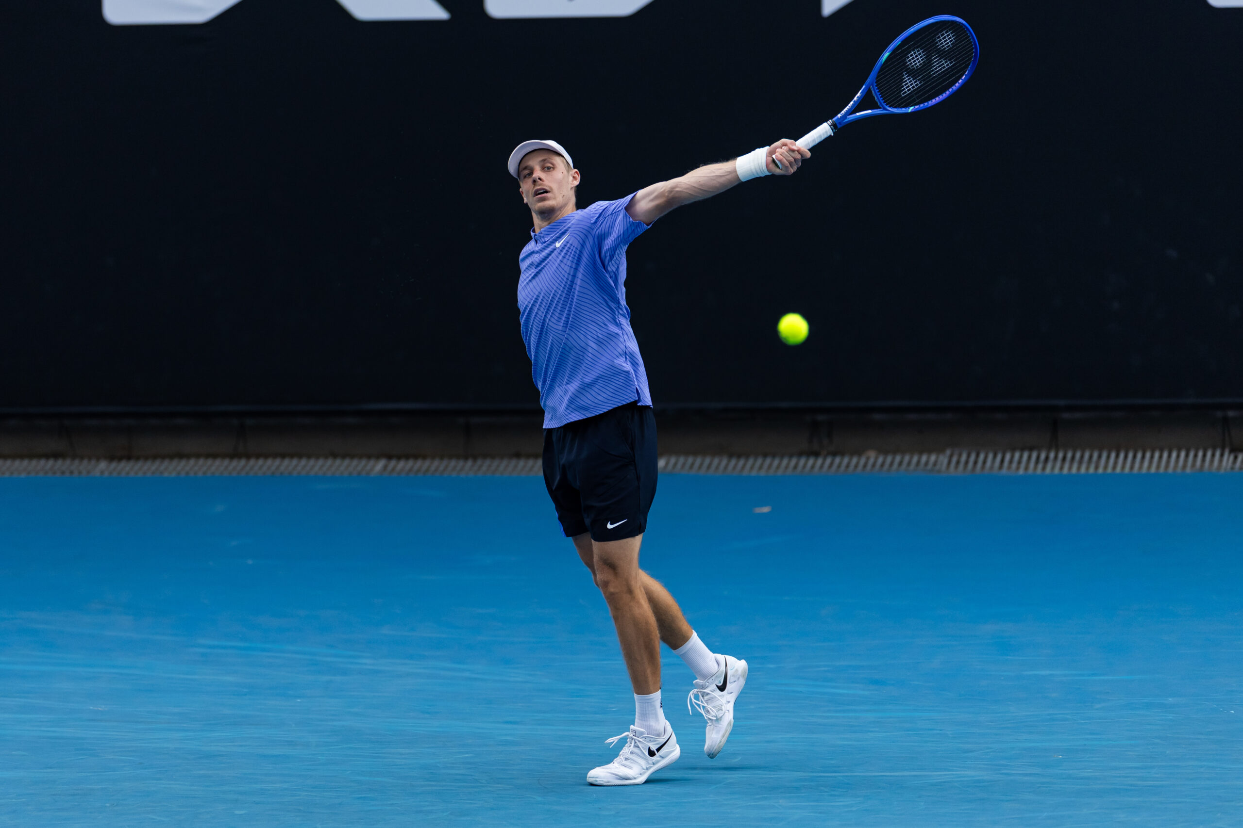 Jan 19, 2026; Melbourne, Victoria, Australia; Denis Shapovalov of Canada in action against Yunchaokete Bu of China in the first round of the men’s singles at the Australian Open at ANZ Arena in Melbourne Park. Mandatory Credit: Mike Frey-Imagn Images