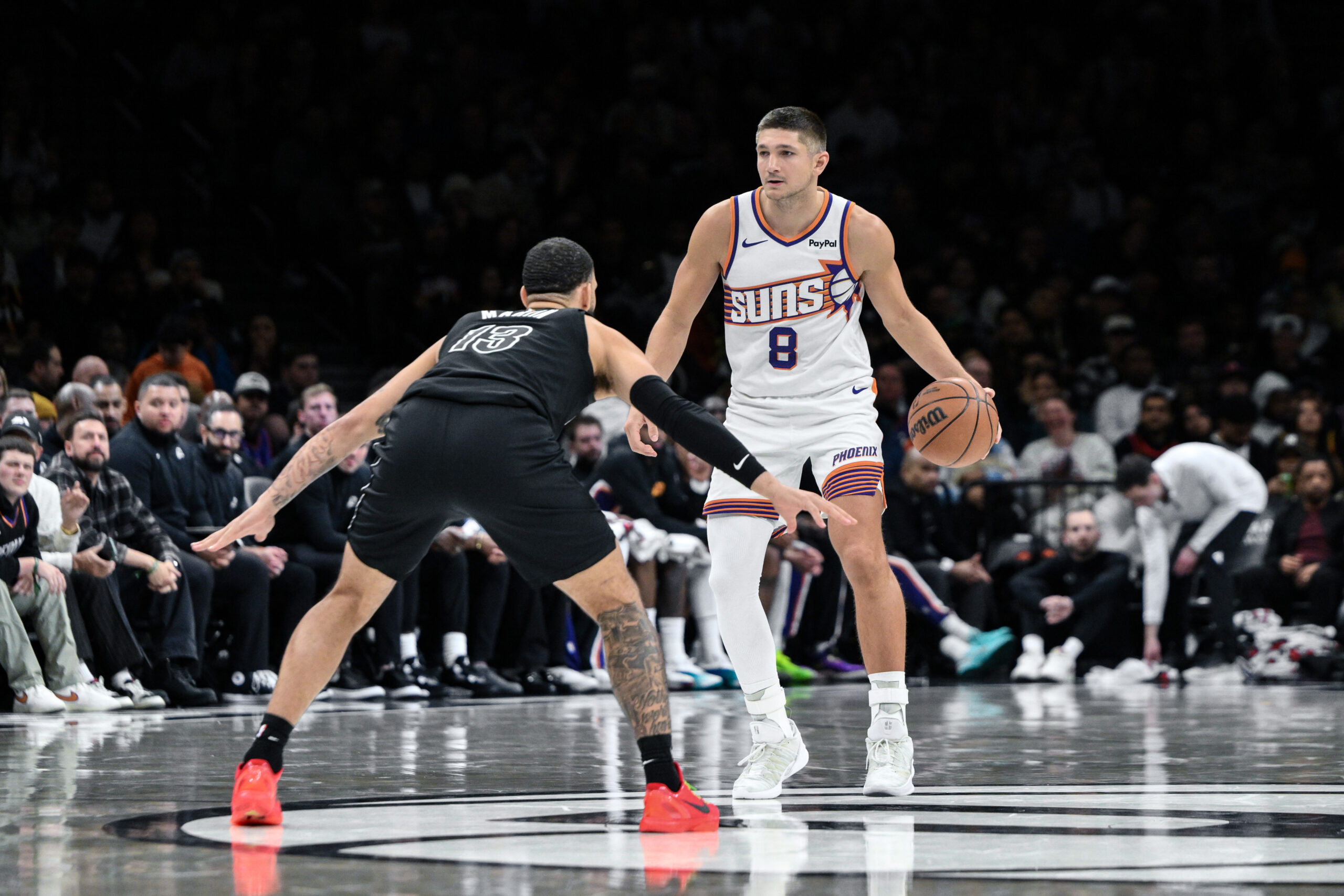 Jan 19, 2026; Brooklyn, New York, USA; Phoenix Suns guard Grayson Allen (8) brings the ball up court against Brooklyn Nets forward Tyrese Martin (13) during the second half at Barclays Center. Mandatory Credit: John Jones-Imagn Images