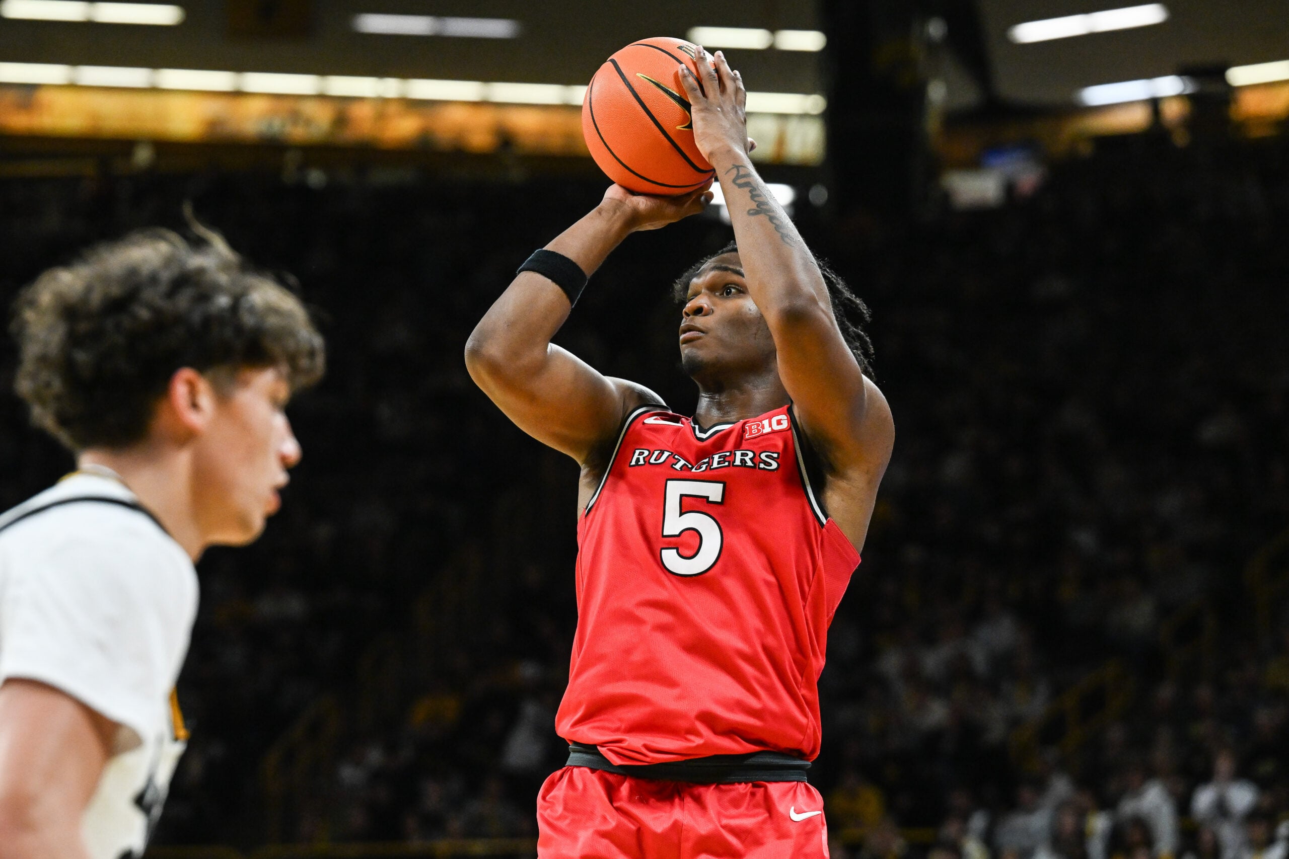 Jan 20, 2026; Iowa City, Iowa, USA; Rutgers Scarlet Knights guard Darren Buchanan Jr. (5) shoots the ball against the Iowa Hawkeyes during the first half at Carver-Hawkeye Arena. Mandatory Credit: Jeffrey Becker-Imagn Images