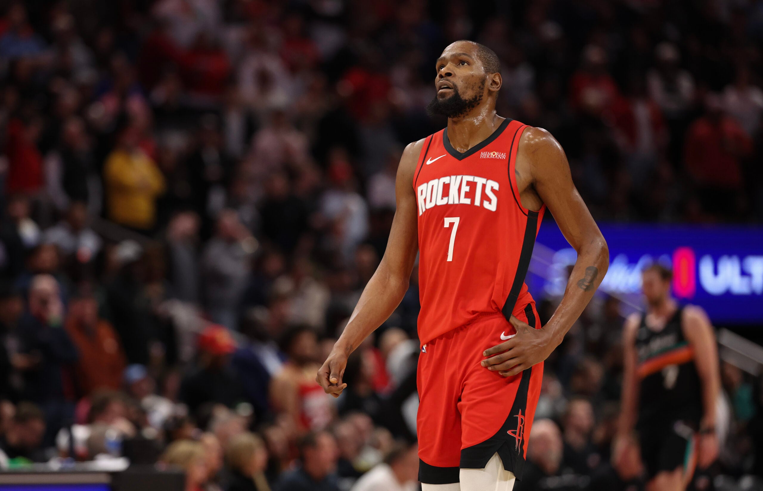 Jan 20, 2026; Houston, Texas, USA; Houston Rockets forward Kevin Durant (7) looks up at the replay board while playing against the San Antonio Spurs timeout in the second half at Toyota Center. Mandatory Credit: Thomas Shea-Imagn Images
