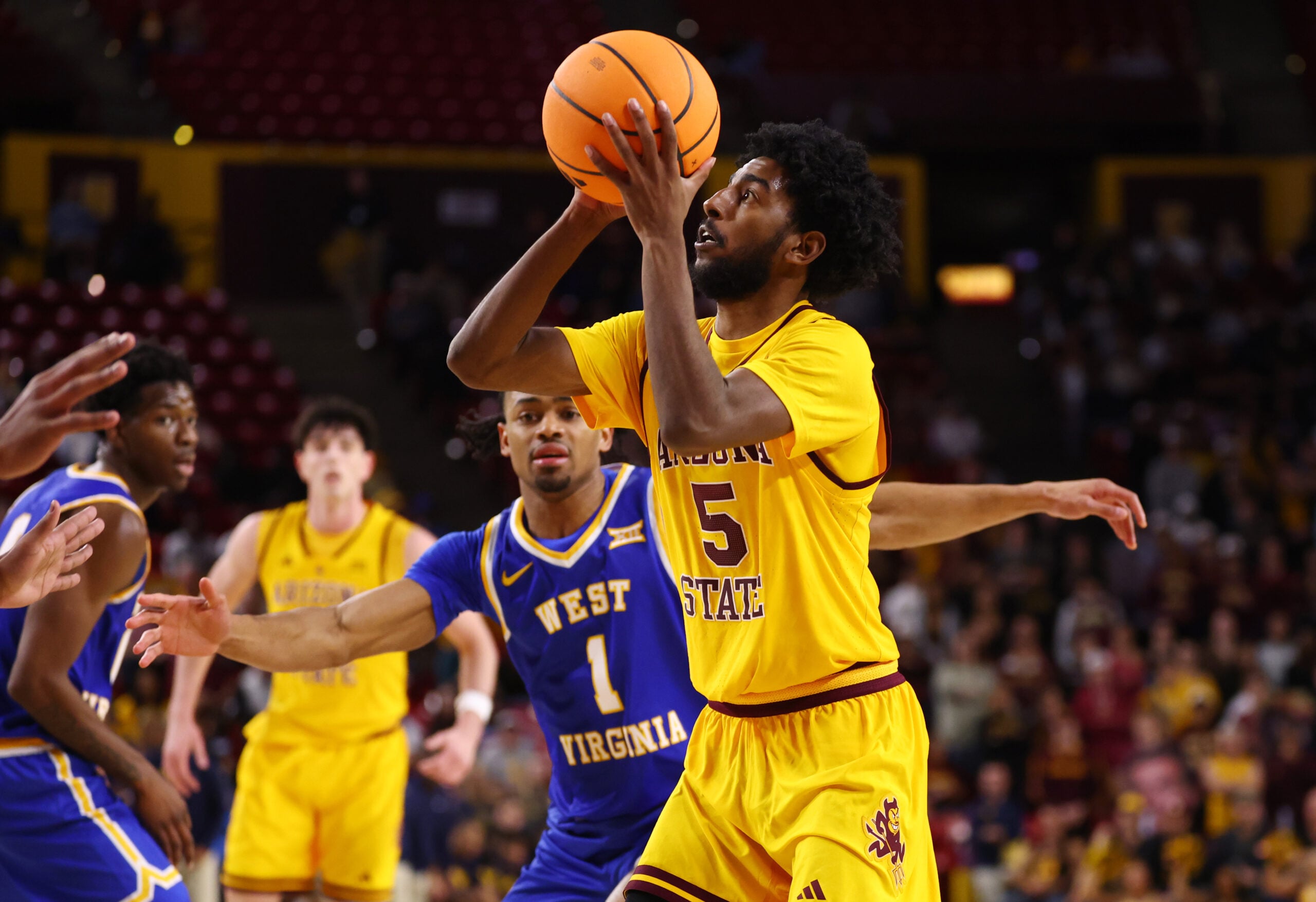 Jan 21, 2026; Tempe, Arizona, USA; Arizona State Sun Devils guard Maurice Odum (5) against the West Virginia Mountaineers in the second half at Desert Financial Arena. Mandatory Credit: Mark J. Rebilas-Imagn Images