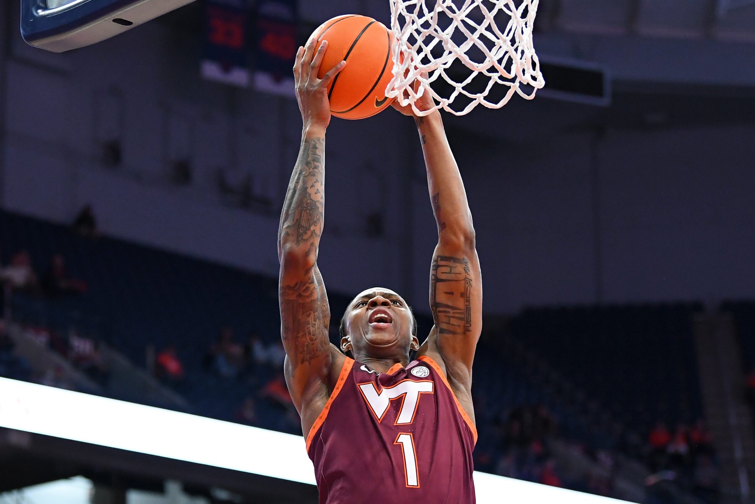 Jan 21, 2026; Syracuse, New York, USA; Virginia Tech Hokies forward Tobi Lawal (1) shoots against the Syracuse Orange during the first half at the JMA Wireless Dome. Mandatory Credit: Rich Barnes-Imagn Images