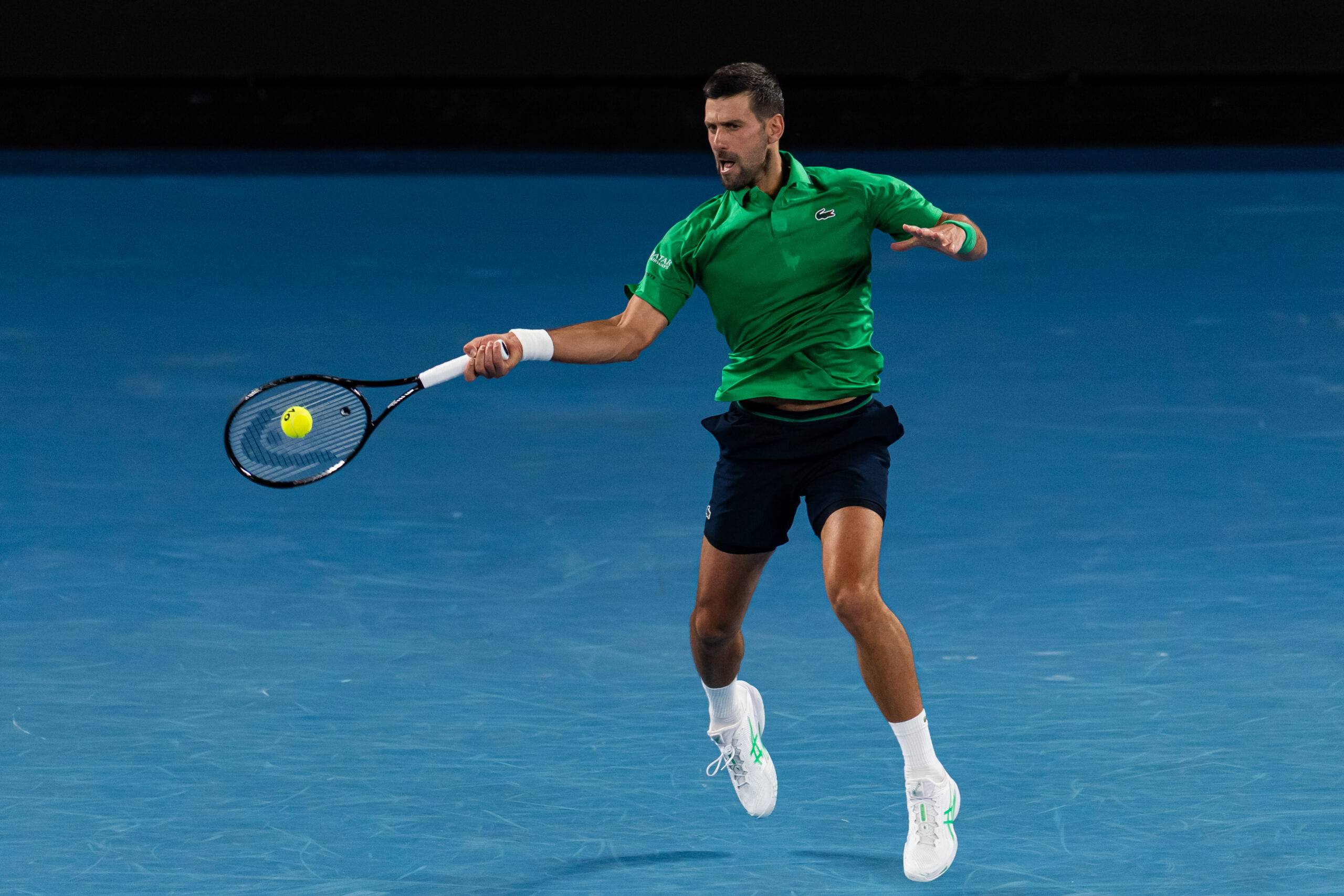Jan 24, 2026; Melbourne, Victoria, Australia; Novak Djokovic of Serbia in action against Botic van de Zandschulp of Netherlands in the third round of the menís singles at the Australian Open at Rod Laver Arena in Melbourne Park. Mandatory Credit: Mike Frey-Imagn Images