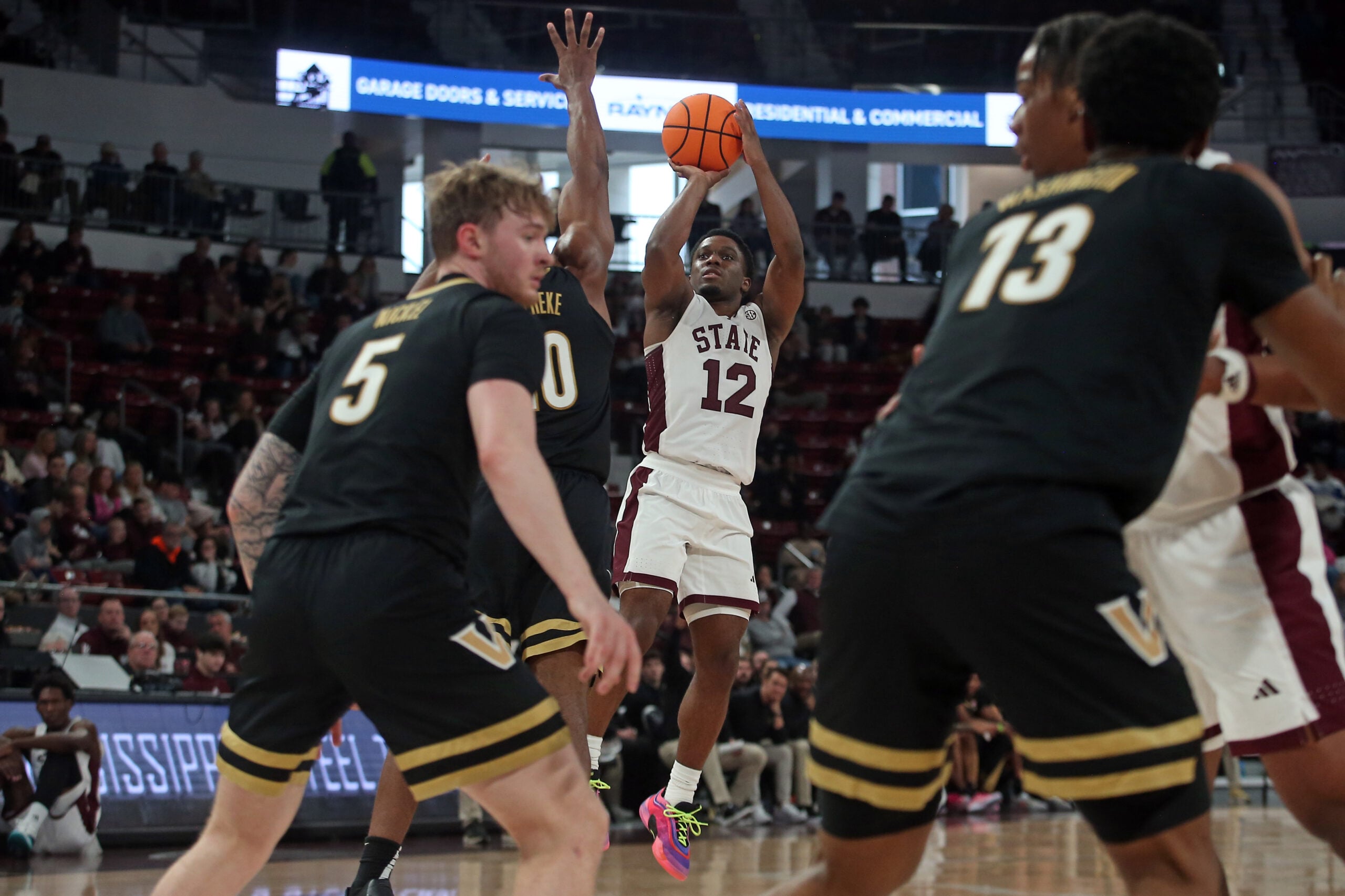 Jan 24, 2026; Starkville, Mississippi, USA; Mississippi State Bulldogs guard Josh Hubbard (12) shoots during the second half against the Vanderbilt Commodores at Humphrey Coliseum. Mandatory Credit: Petre Thomas-Imagn Images