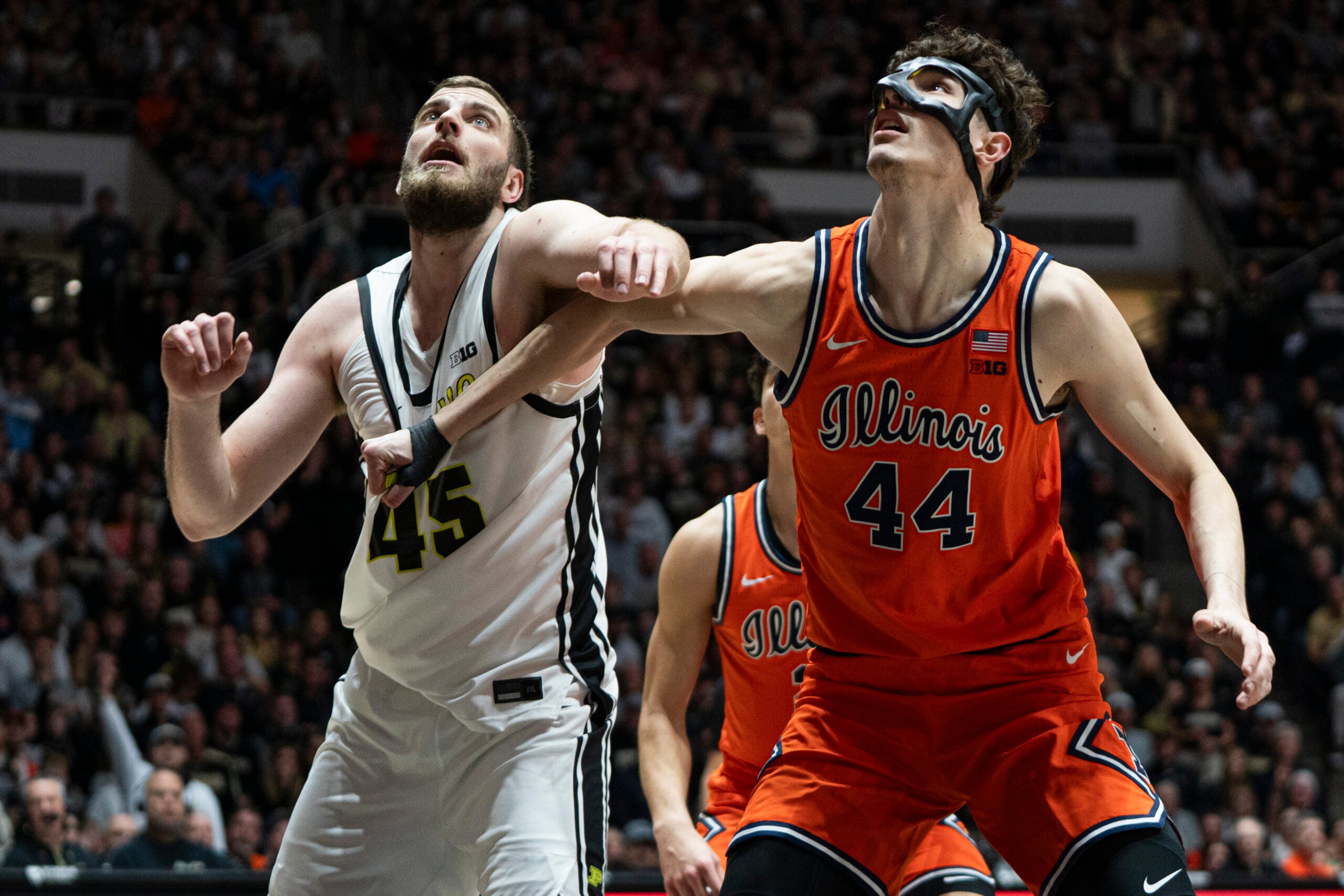 Jan 24, 2026; West Lafayette, Indiana, USA; Illinois Fighting Illini center Zvonimir Ivisic (44) pulls down the jersey of Purdue Boilermakers center Oscar Cluff (45) during the second half at Mackey Arena. Mandatory Credit: Jacob Musselman-Imagn Images