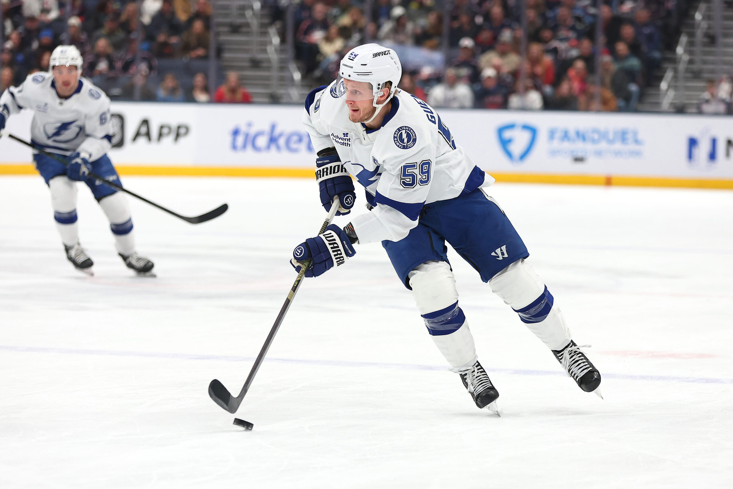 Jan 24, 2026; Columbus, Ohio, USA; Tampa Bay Lightning center Jake Guentzel (59) looks to pass the puck during the first period against the Columbus Blue Jackets at Nationwide Arena. Mandatory Credit: Joseph Maiorana-Imagn Images