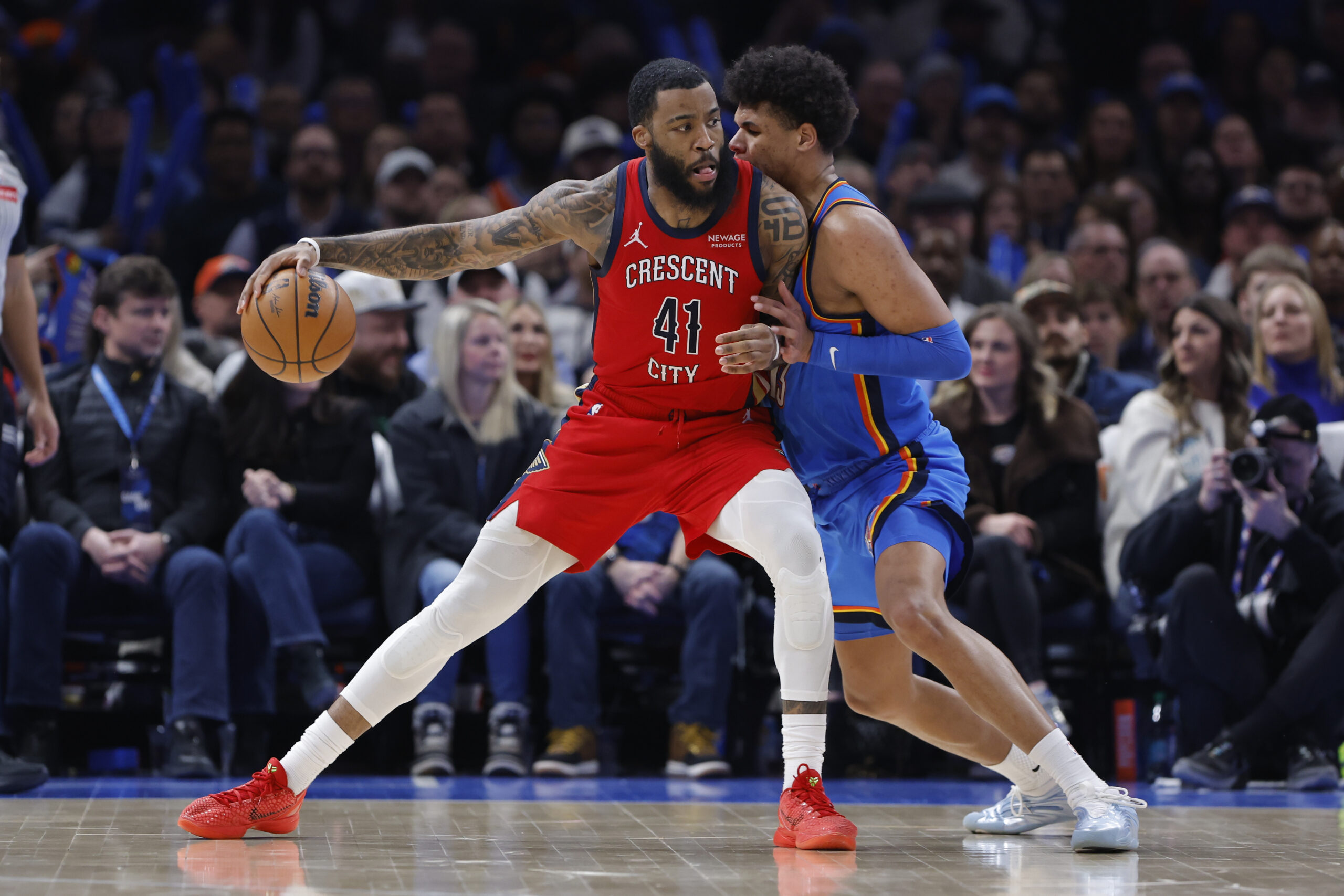 Jan 27, 2026; Oklahoma City, Oklahoma, USA; New Orleans Pelicans guard/forward Saddiq Bey (41) drives against Oklahoma City Thunder forward Ousmane Dieng (13) during the second half at Paycom Center. Mandatory Credit: Alonzo Adams-Imagn Images
