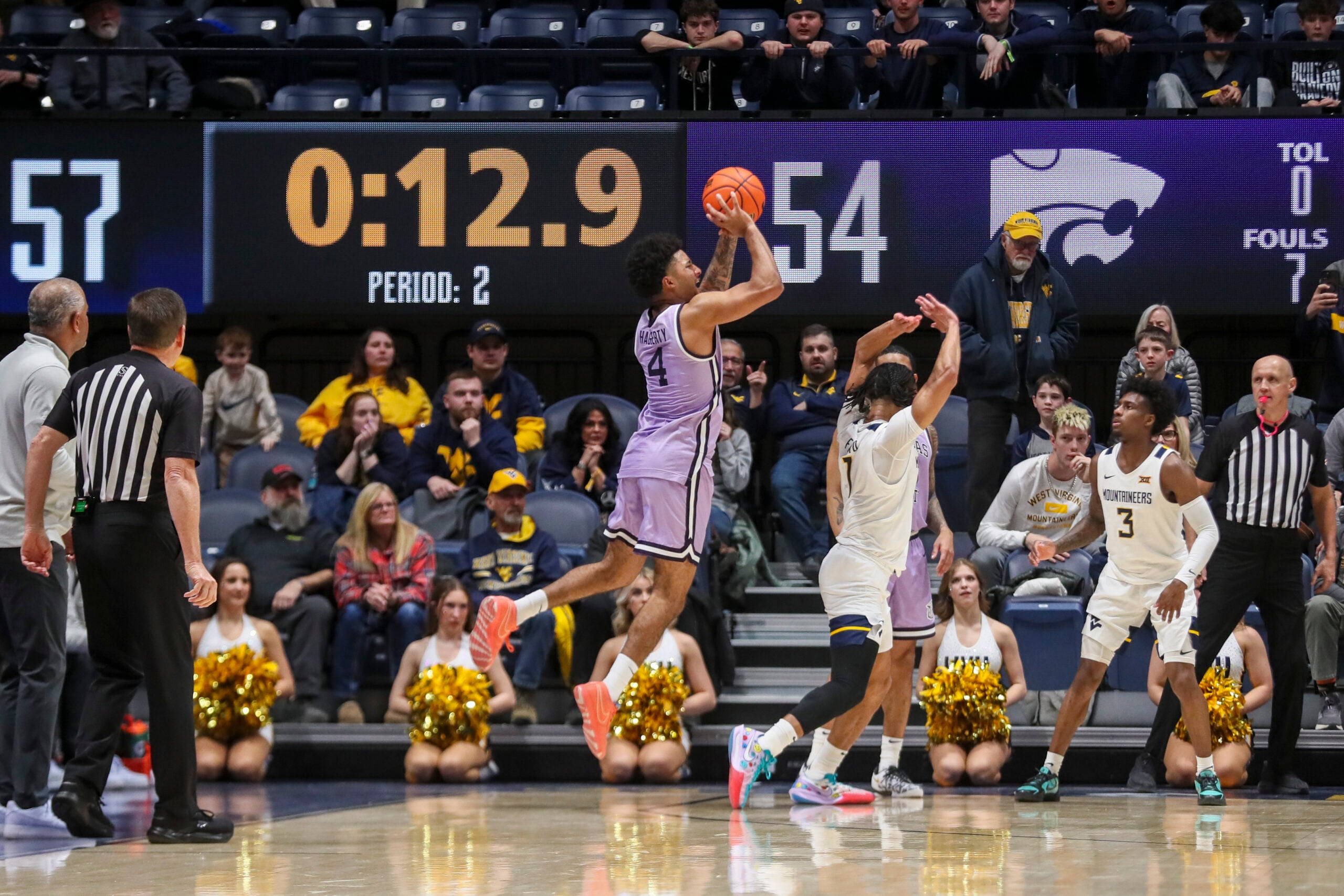 Jan 27, 2026; Morgantown, West Virginia, USA; Kansas State Wildcats guard PJ Haggerty (4) shoots a three pointer late in the second half against the West Virginia Mountaineers at Hope Coliseum. Mandatory Credit: Ben Queen-Imagn Imagesa