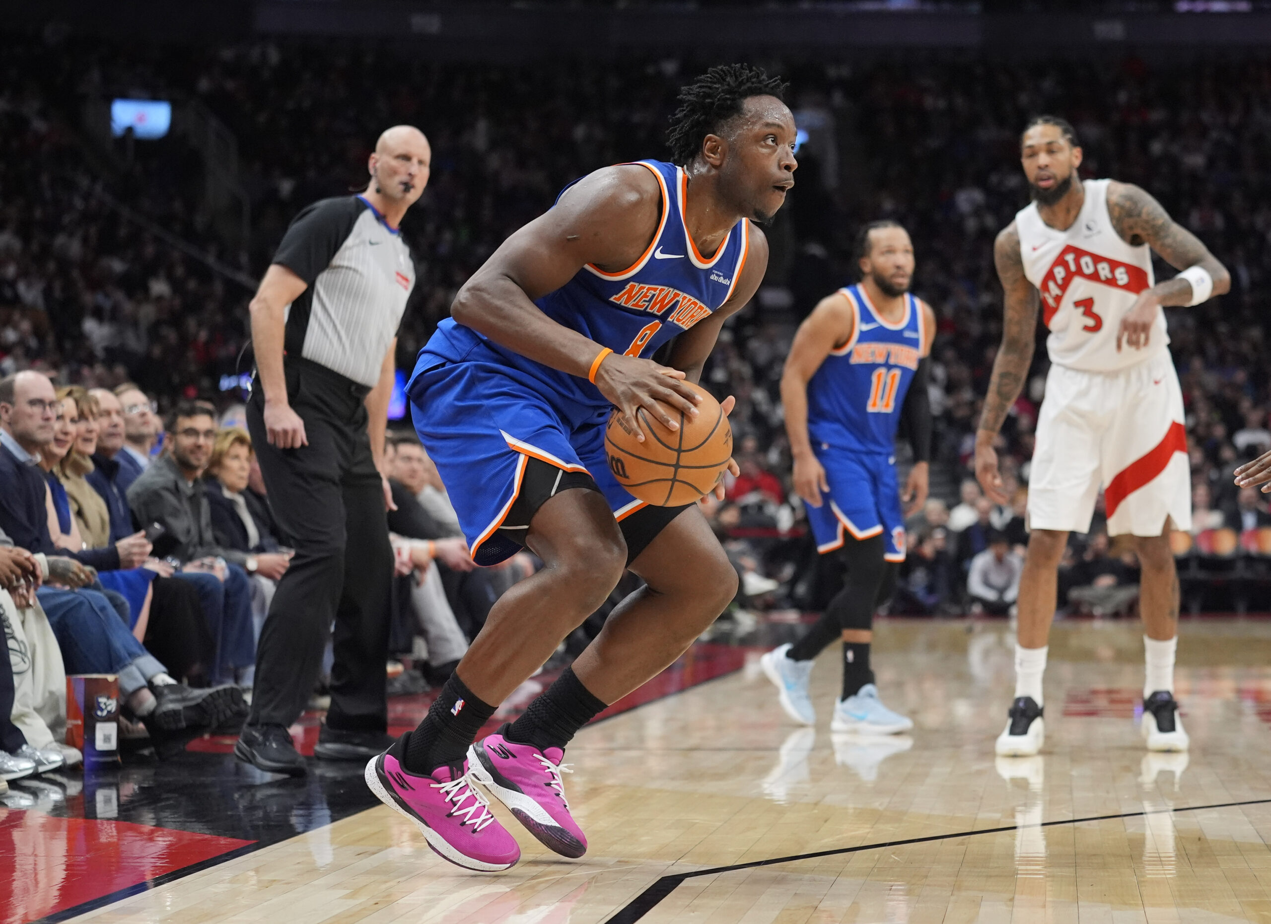 Jan 28, 2026; Toronto, Ontario, CAN; New York Knicks forward OG Anunoby (8) looks for a play against the Toronto Raptors during the first half at Scotiabank Arena. Mandatory Credit: John E. Sokolowski-Imagn Images