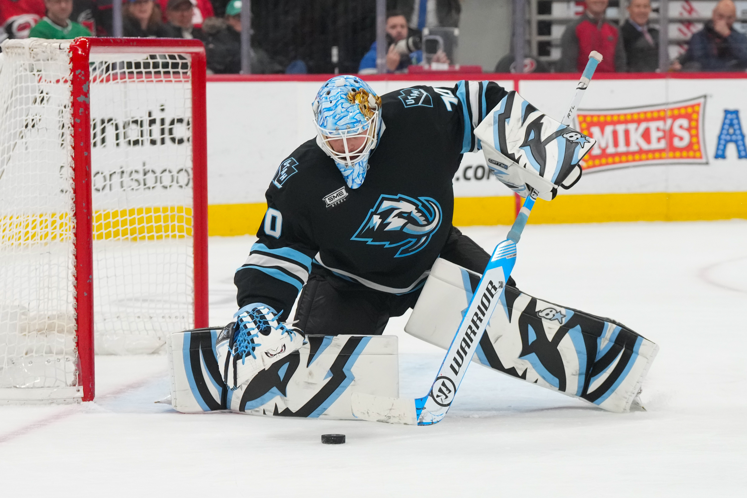 Jan 29, 2026; Raleigh, North Carolina, USA; Utah Mammoth goaltender Karel Vejmelka (70) makes a save against the Carolina Hurricanes during the third period at Lenovo Center. Mandatory Credit: James Guillory-Imagn Images