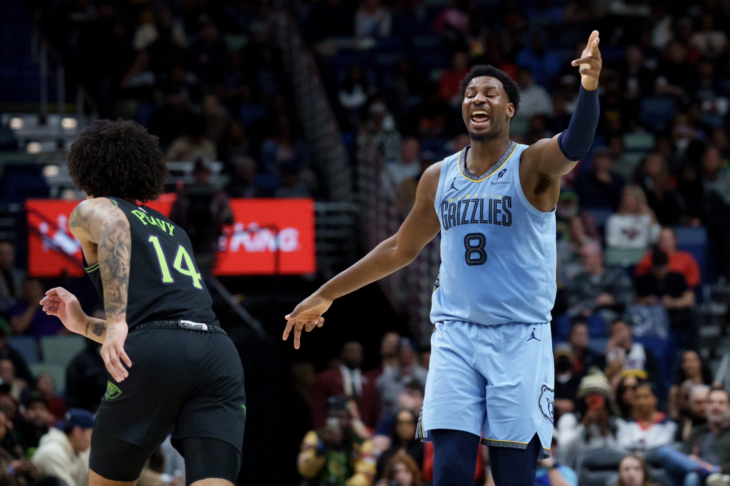 Jan 30, 2026; New Orleans, Louisiana, USA; Memphis Grizzlies forward Jaren Jackson Jr. (8) reacts after a three point basket against New Orleans Pelicans guard Micah Peavy (14) during the first half at Smoothie King Center. Mandatory Credit: Matthew Hinton-Imagn Images