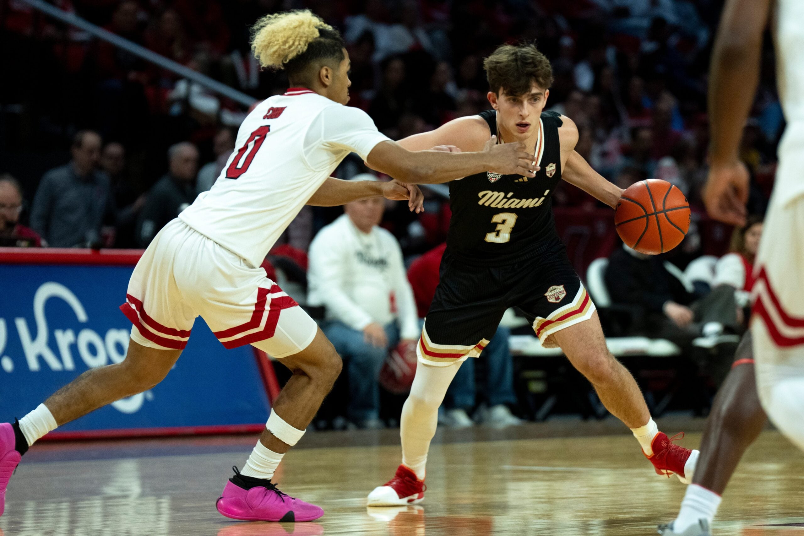 Miami RedHawks guard Luke Skaljac (3) drives on Northern Illinois Huskies guard Gianni Cobb (0) in the first half of the NCAA Basketball game at Millett Hall in Oxford, Ohio, on Saturday, January 31, 2026.