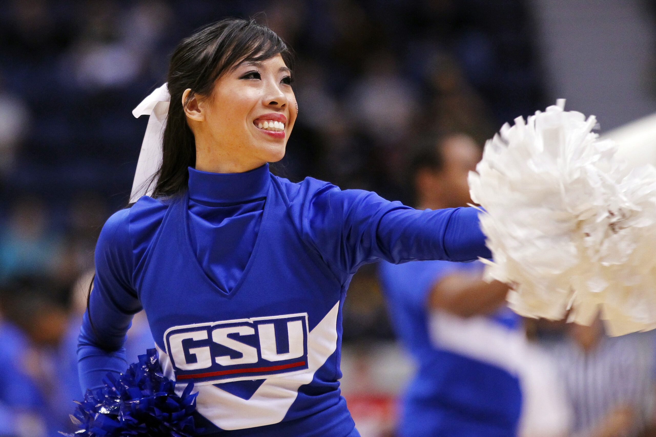 March 3, 2012; Richmond, VA USA; A Georgia State Panthers cheerleader dances on the court during a stoppage in play against the George Mason Patriots in the second half of their quarterfinal game of the 2012 Colonial Athletic Association tournament at the Richmond Coliseum. The Patriots won 61-59. Mandatory Credit: Geoff Burke-Imagn Images