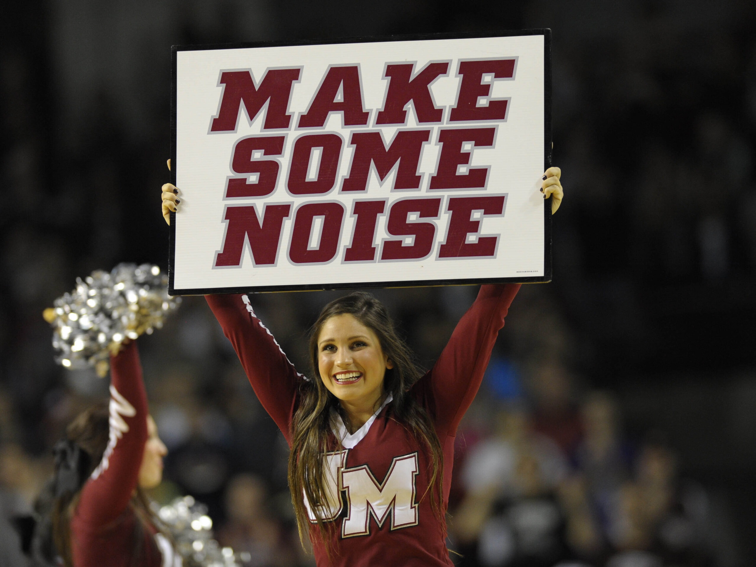 Jan 11, 2014; Amherst, MA, USA; The Massachusetts Minutemen cheerleaders perform during a timeout in the second half against the St. Bonaventure Bonnies at Mullins Center. Mandatory Credit: Bob DeChiara-Imagn Images