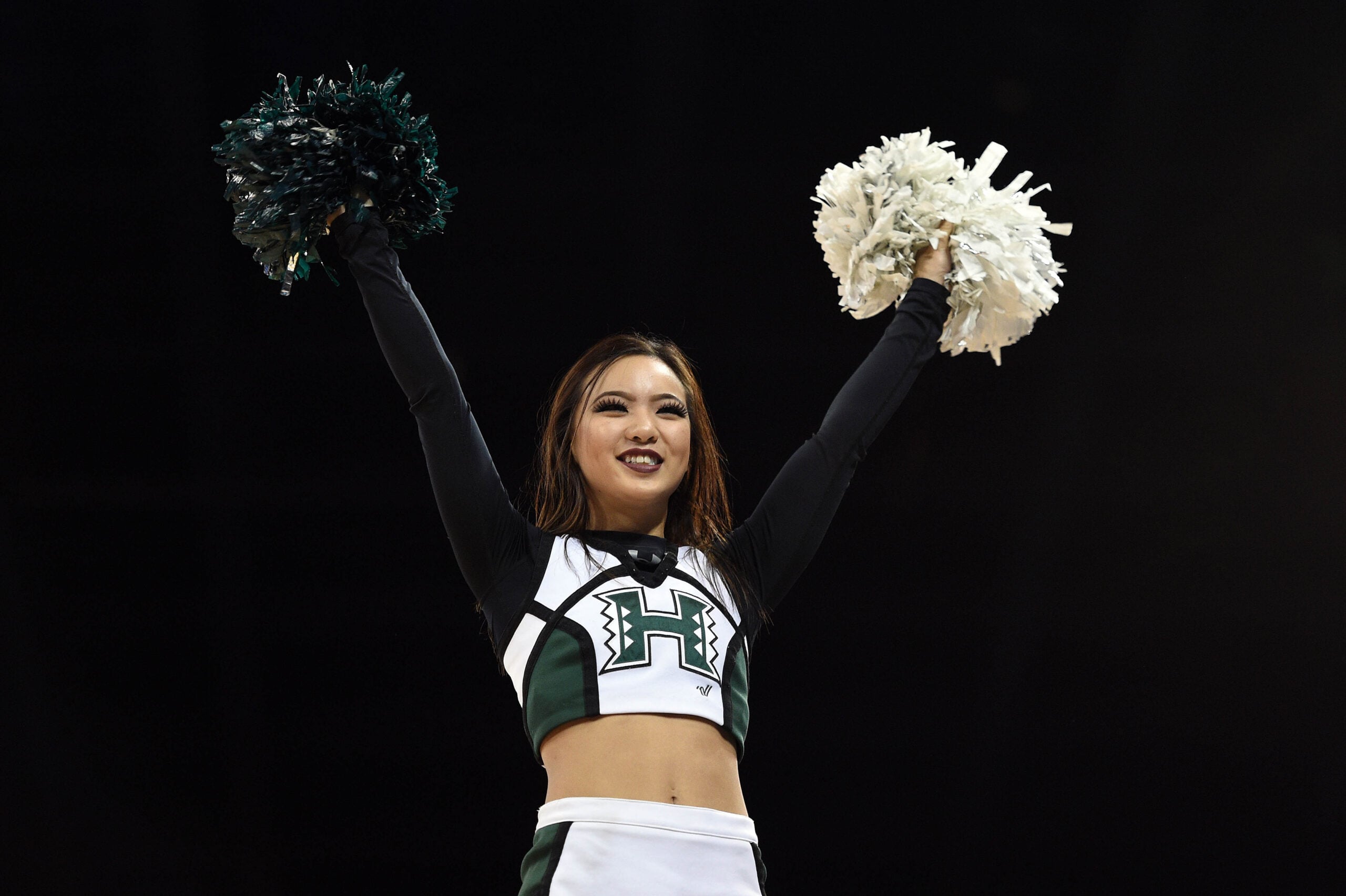 March 20, 2016; Spokane , WA, USA; Hawaii Rainbow Warriors cheerleader performs during the second half in the second round of the 2016 NCAA Tournament at Spokane Veterans Memorial Arena. Mandatory Credit: Kyle Terada-Imagn Images