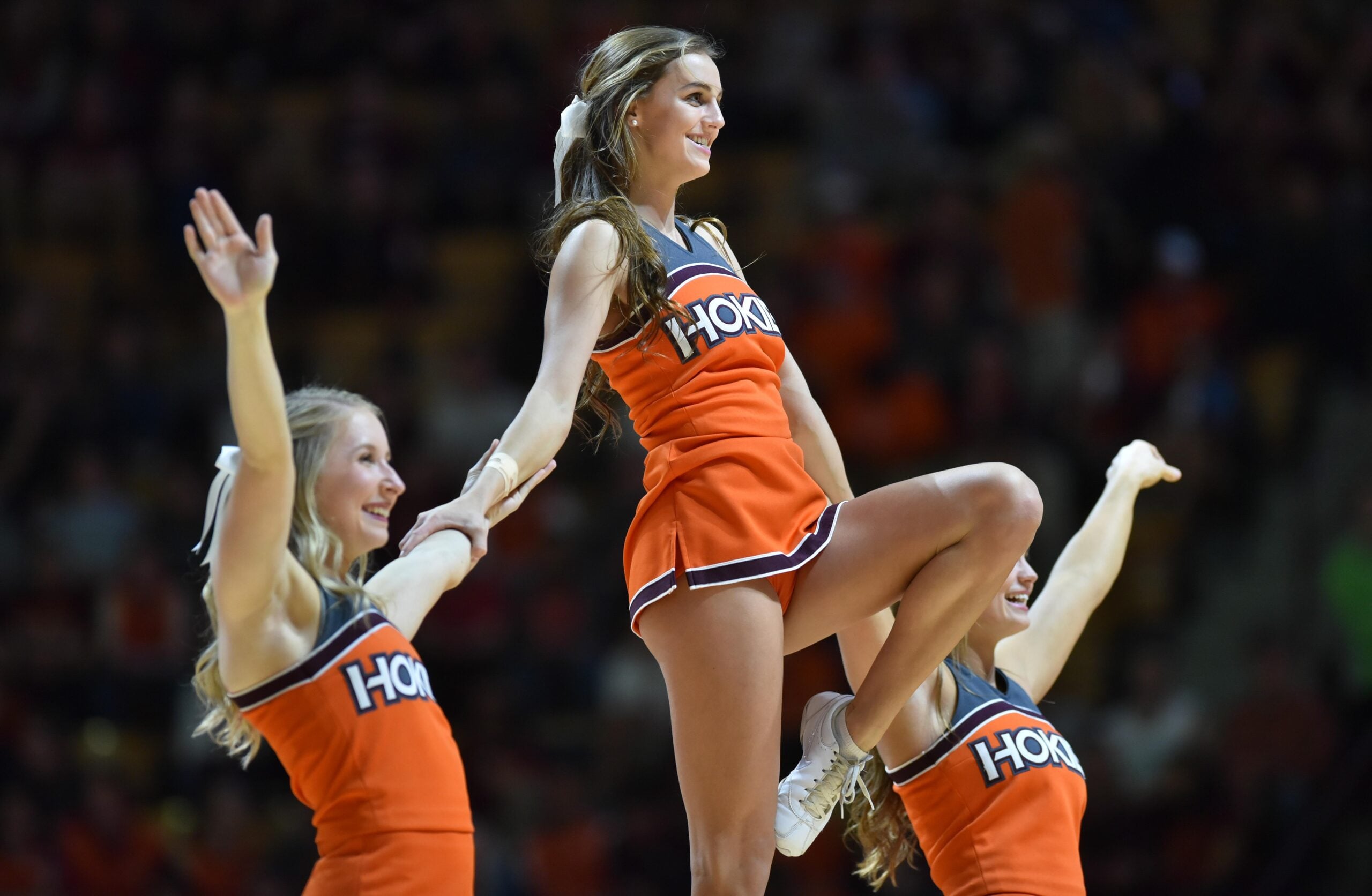 Jan 18, 2017; Blacksburg, VA, USA; Members of the Virginia Tech Hokies cheerleading squad perform during the game against the Georgia Tech Yellow Jackets at Cassell Coliseum. Mandatory Credit: Michael Shroyer-Imagn Images