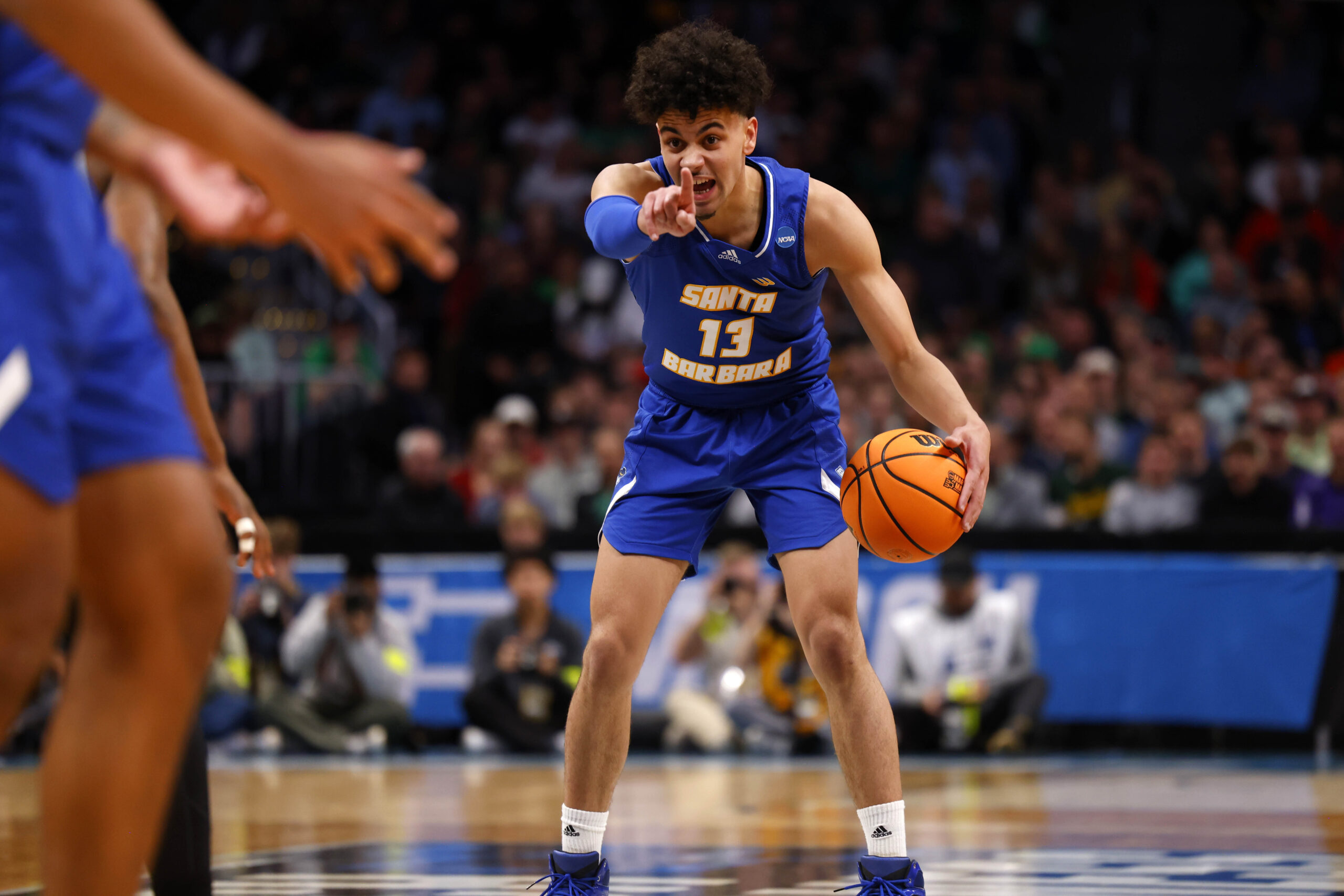 Mar 17, 2023; Denver, CO, USA;  UC Santa Barbara Gauchos guard Ajay Mitchell (13) signals to teammates during the first half against Baylor Bears in the first round of the 2023 NCAA men   s basketball tournament at Ball Arena. Mandatory Credit: Michael Ciaglo-Imagn Images