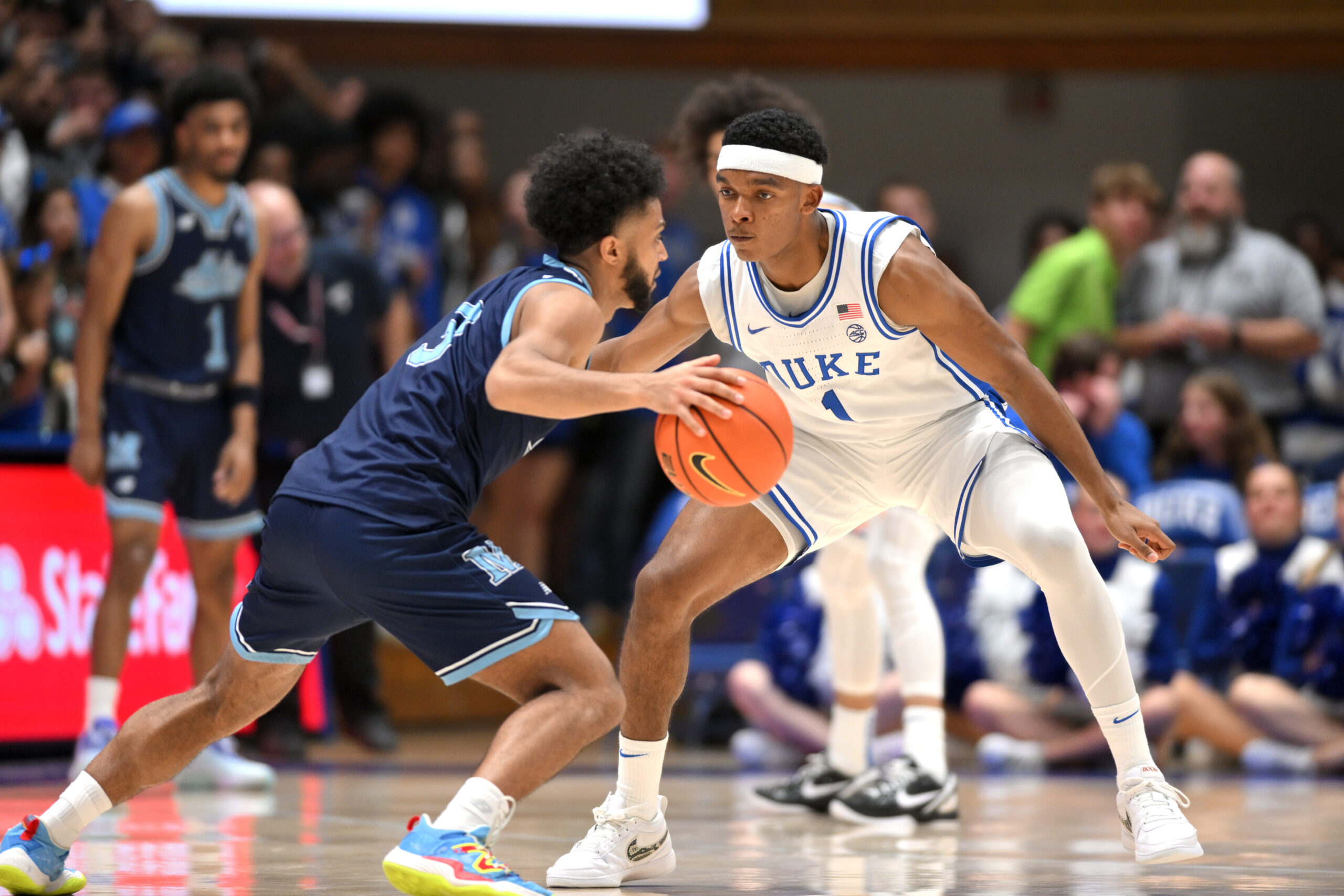Nov 4, 2024; Durham, North Carolina, USA; Duke Blue Devils guard Caleb Foster (1) guards against Maine Black Bears guard Jaden Clayton (3) at Cameron Indoor Stadium in the second half. Mandatory Credit: Zachary Taft-Imagn Images