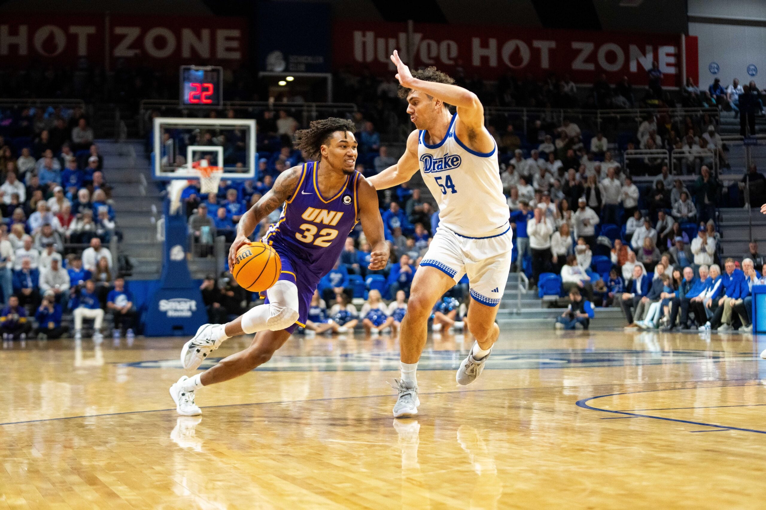 Northern Iowa's Tytan Anderson (32) drives past Drake's Daniel Abreu (54) on Wednesday, Jan. 29, 2025, at the Knapp Center.