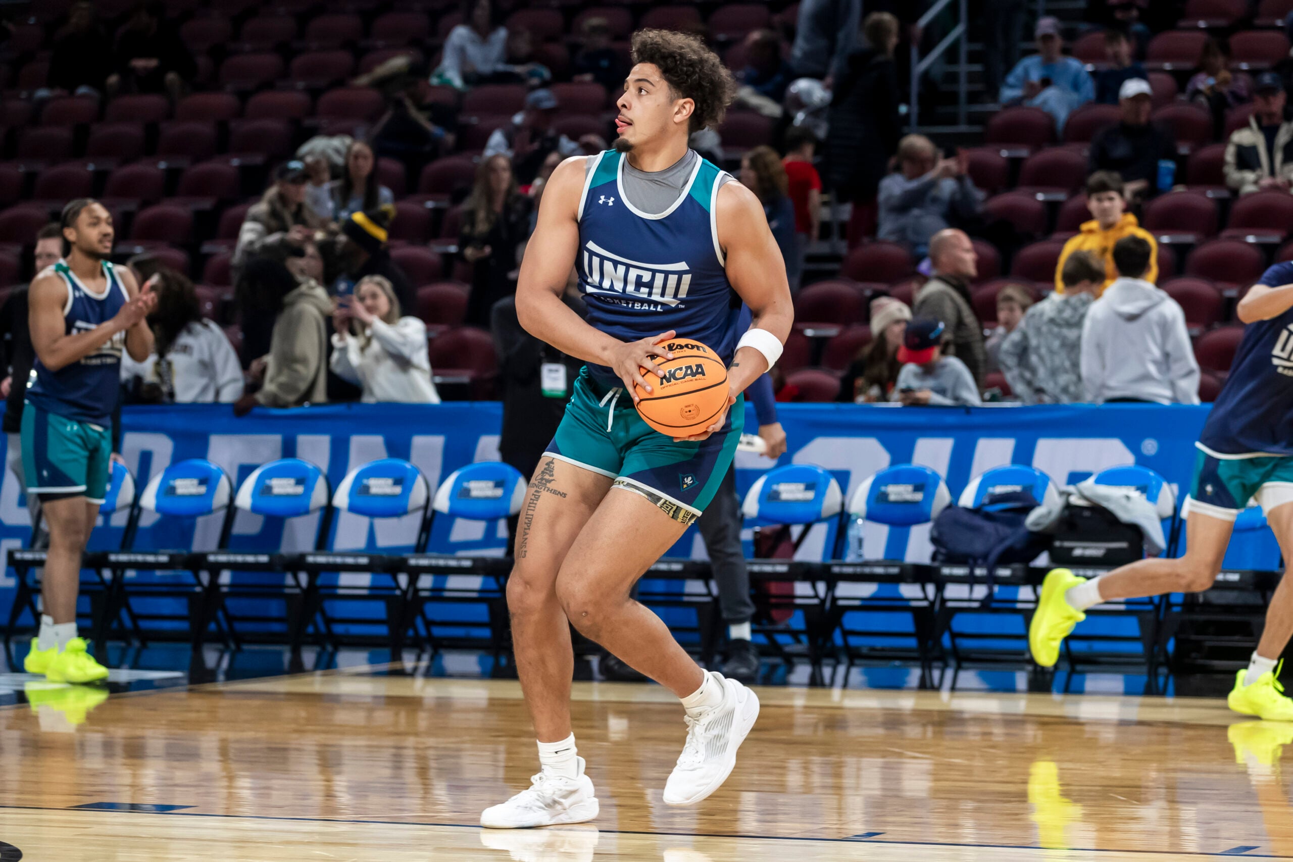 Mar 19, 2025; Wichita, KS, USA;  UNC-Wilmington Seahawks forward Harlan Obioha (55) drives toward the basket during a practice session at Intrust Bank Arena. Mandatory Credit: Nick Tre. Smith-Imagn Images