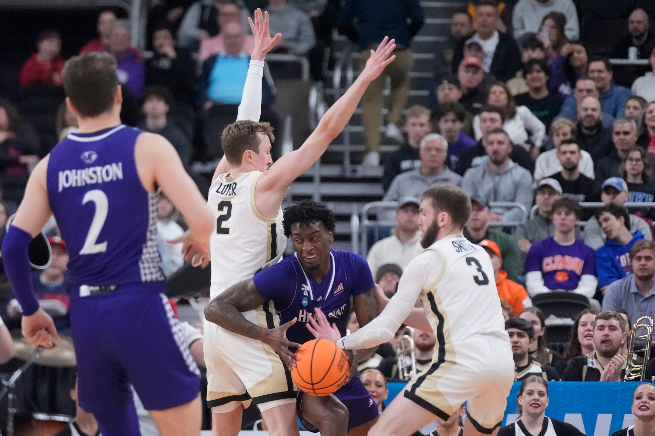 Mar 20, 2025; Providence, RI, USA; High Point Panthers forward Terry Anderson (0) loses control of the ball against Purdue Boilermakers guard Braden Smith (3) and guard Fletcher Loyer (2) during the first half at Amica Mutual Pavilion. Mandatory Credit: Gregory Fisher-Imagn Images