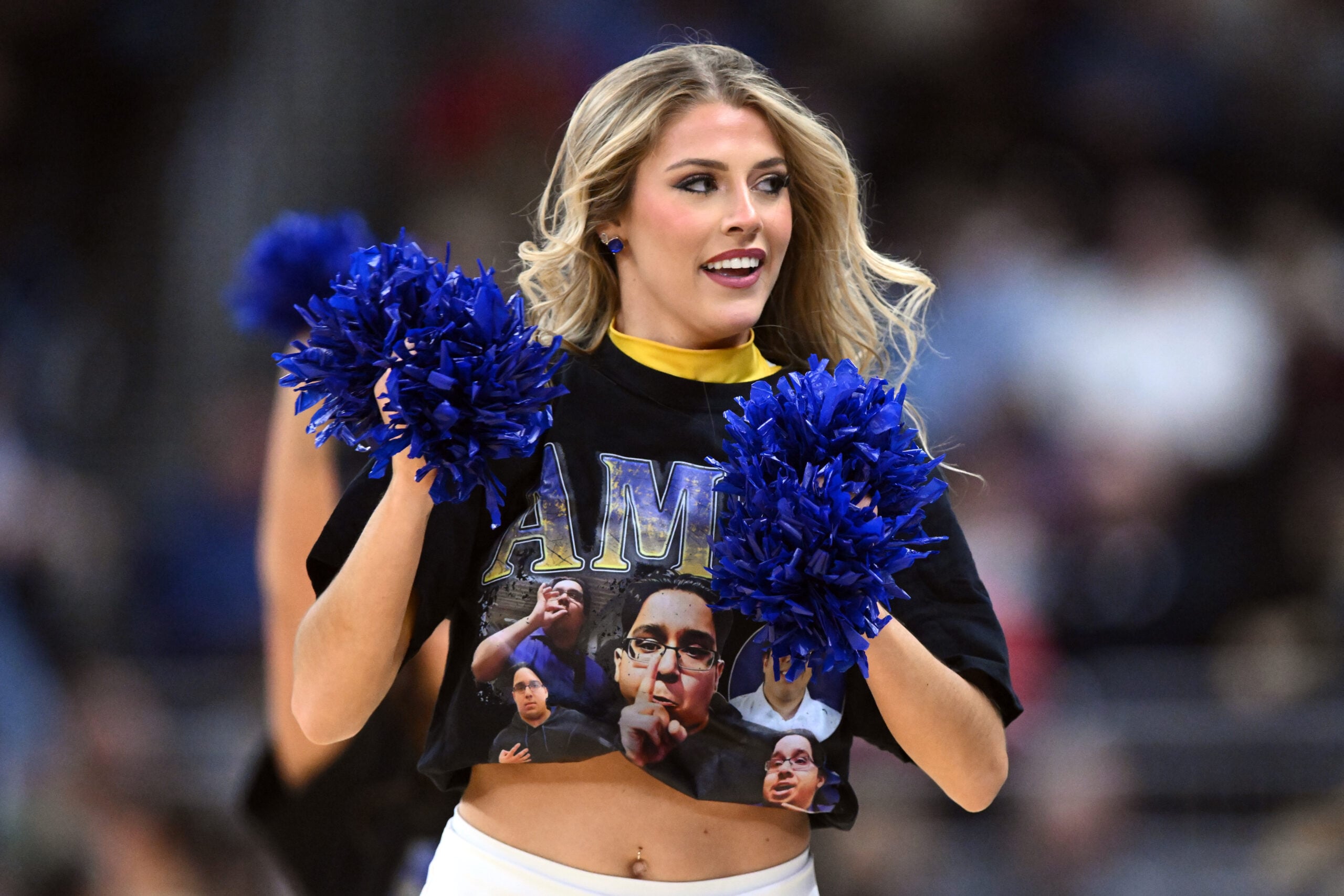Mar 22, 2025; Providence, RI, USA; McNeese State Cowboys cheerleaders wear shirts with McNeese State Cowboys manager Amir Khan (not pictured) during a second round men’s NCAA Tournament game against the Purdue Boilermakers at Amica Mutual Pavilion. Mandatory Credit: Brian Fluharty-Imagn Images