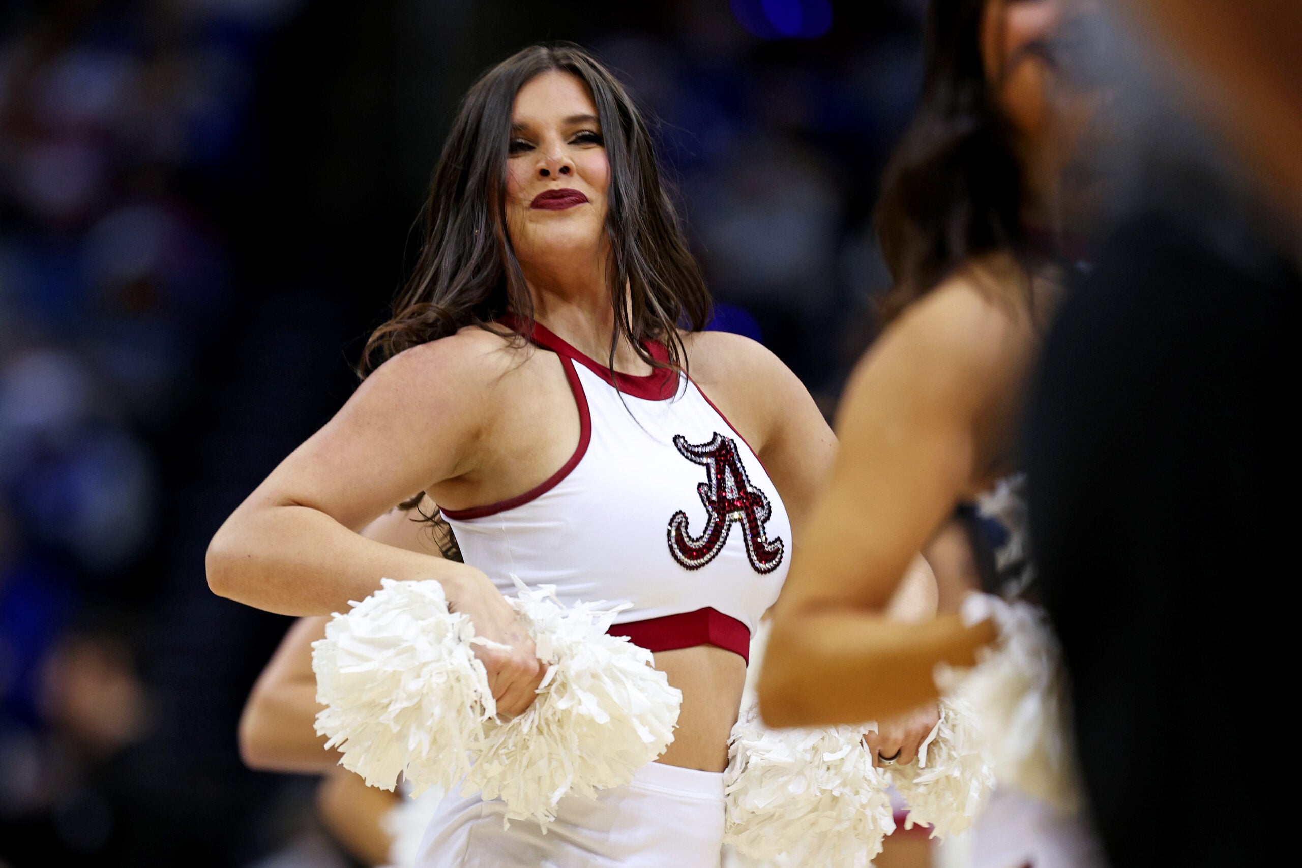 Mar 29, 2025; Newark, NJ, USA; An Alabama Crimson Tide cheerleader during the first half of the East Regional final of the 2025 NCAA tournament between the Duke Blue Devils and the Alabama Crimson Tide at Prudential Center. Mandatory Credit: Vincent Carchietta-Imagn Images