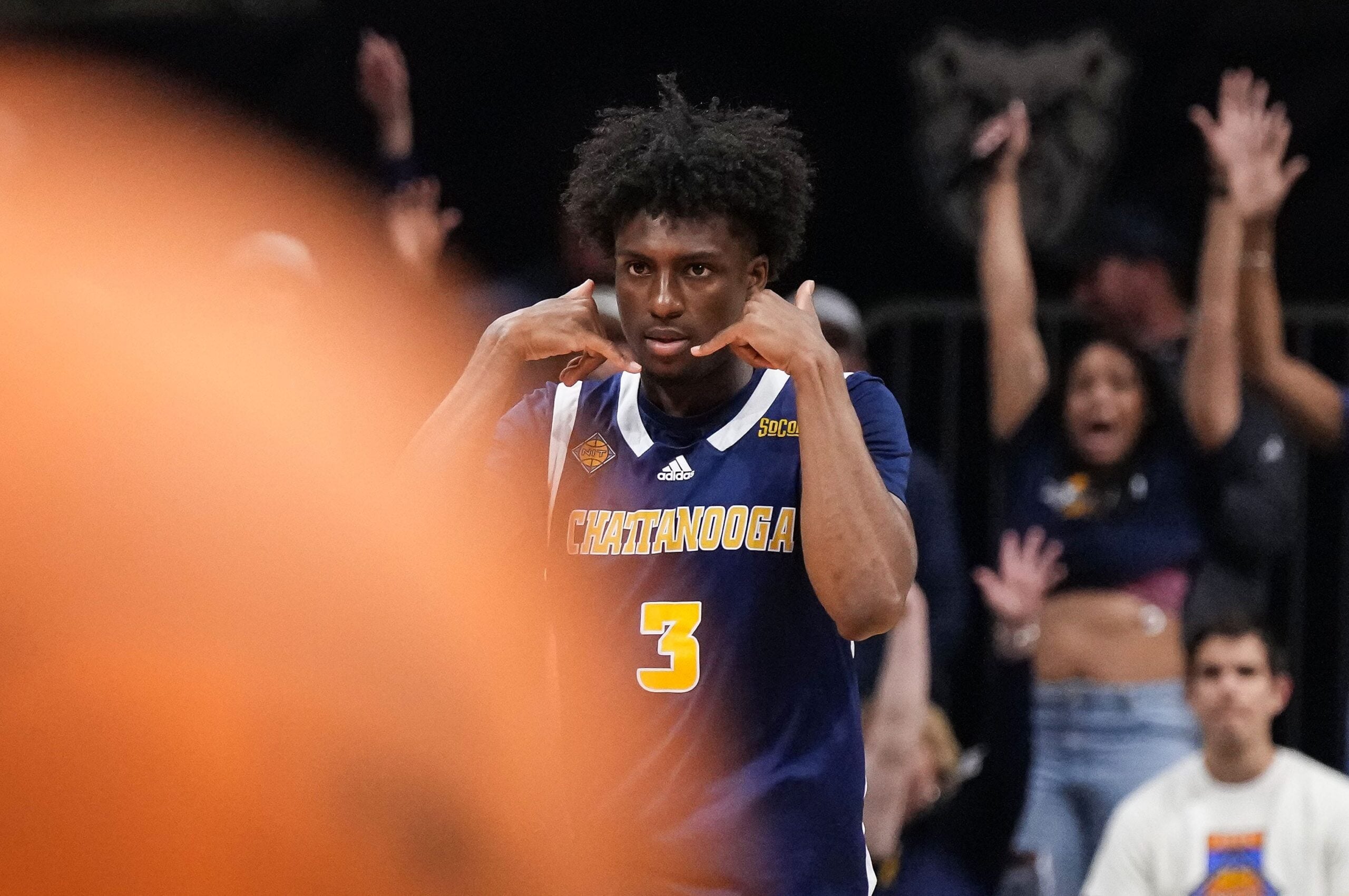 Chattanooga Mocs guard Honor Huff (3) celebrat4es scoring a three point basket Thursday, April 3, 2025, during the National Invitional Tournament at Hinkle Fieldhouse in Indianapolis.