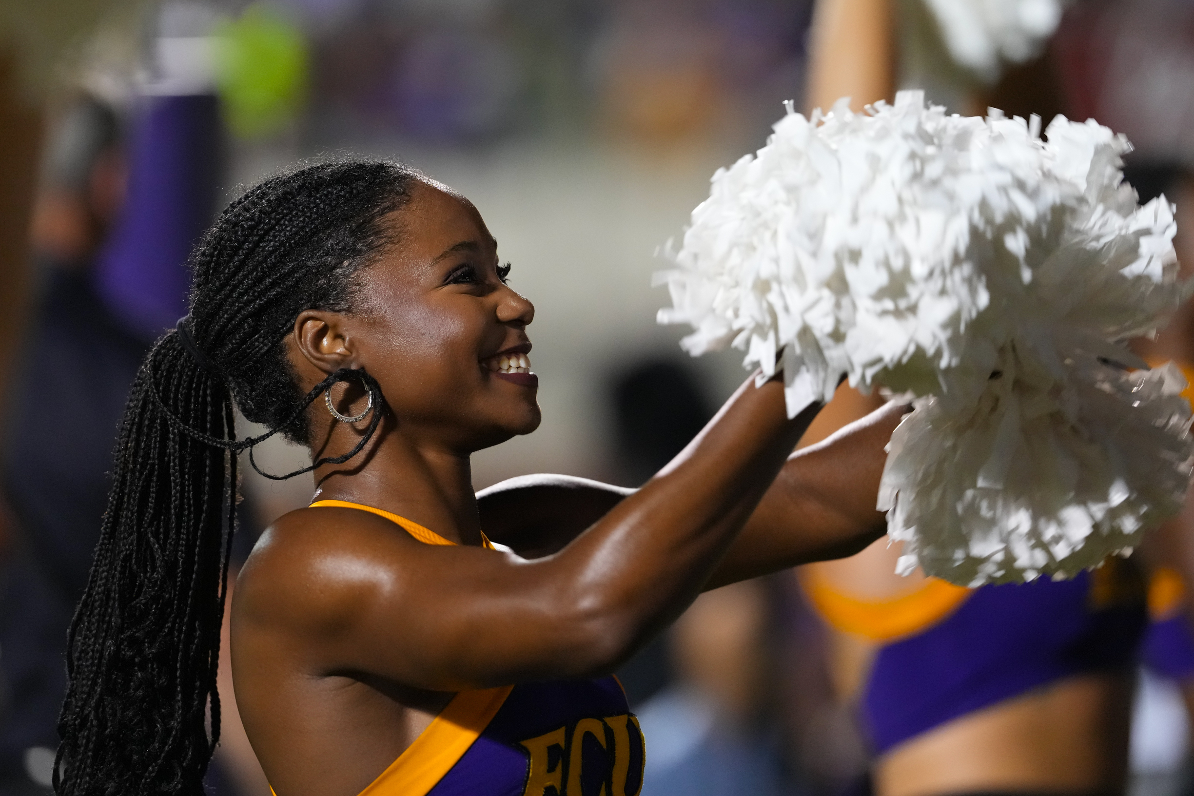 Sep 25, 2025; Greenville, North Carolina, USA; East Carolina Pirates cheerleader smiles against the Army Black Knights during the first half at Dowdy-Ficklen Stadium. Mandatory Credit: James Guillory-Imagn Images