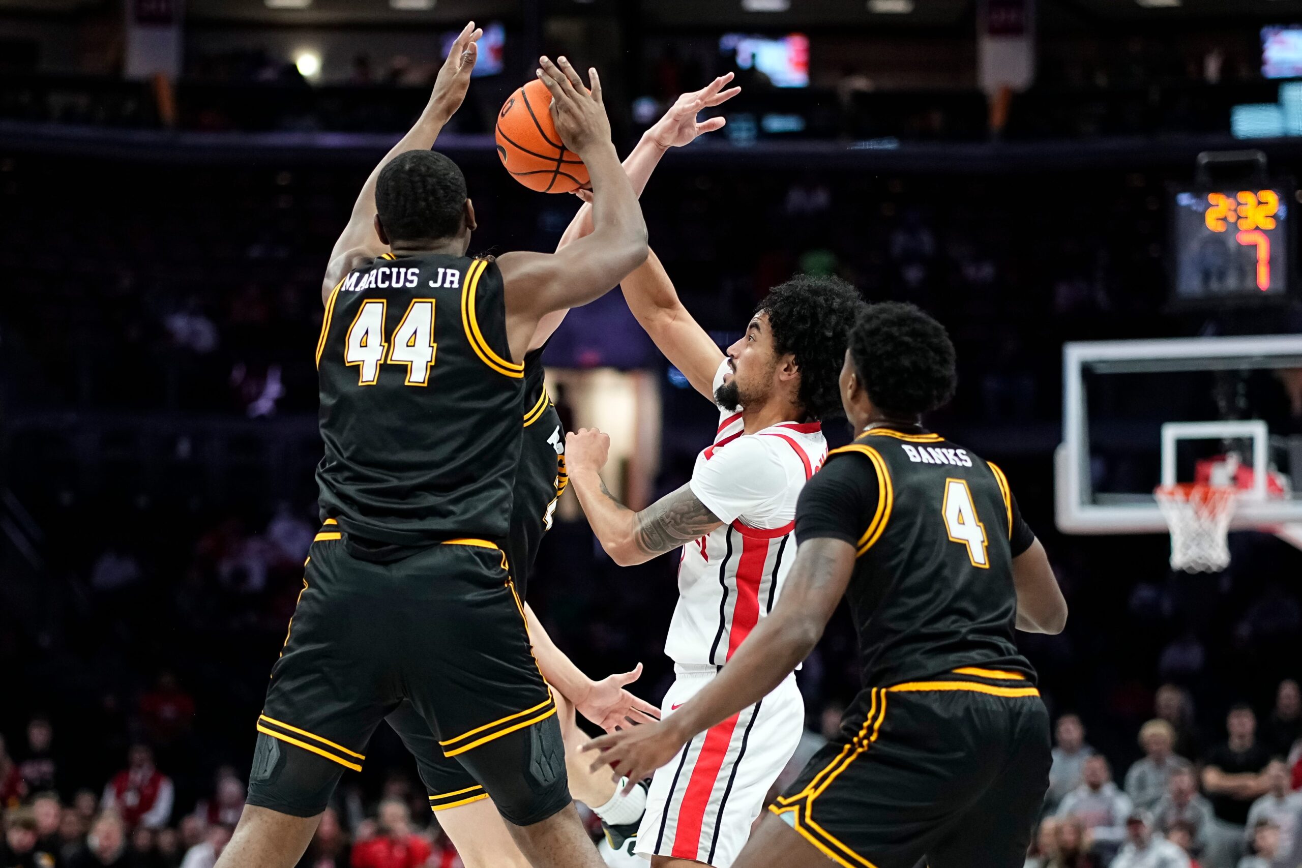 Ohio State Buckeyes guard Taison Chatman (3) passes around Appalachian State Mountaineers forward Michael Marcus Jr. (44) during the NCAA men's basketball game at Value City Arena in Columbus on Nov. 11, 2025. Ohio State won 75-53.