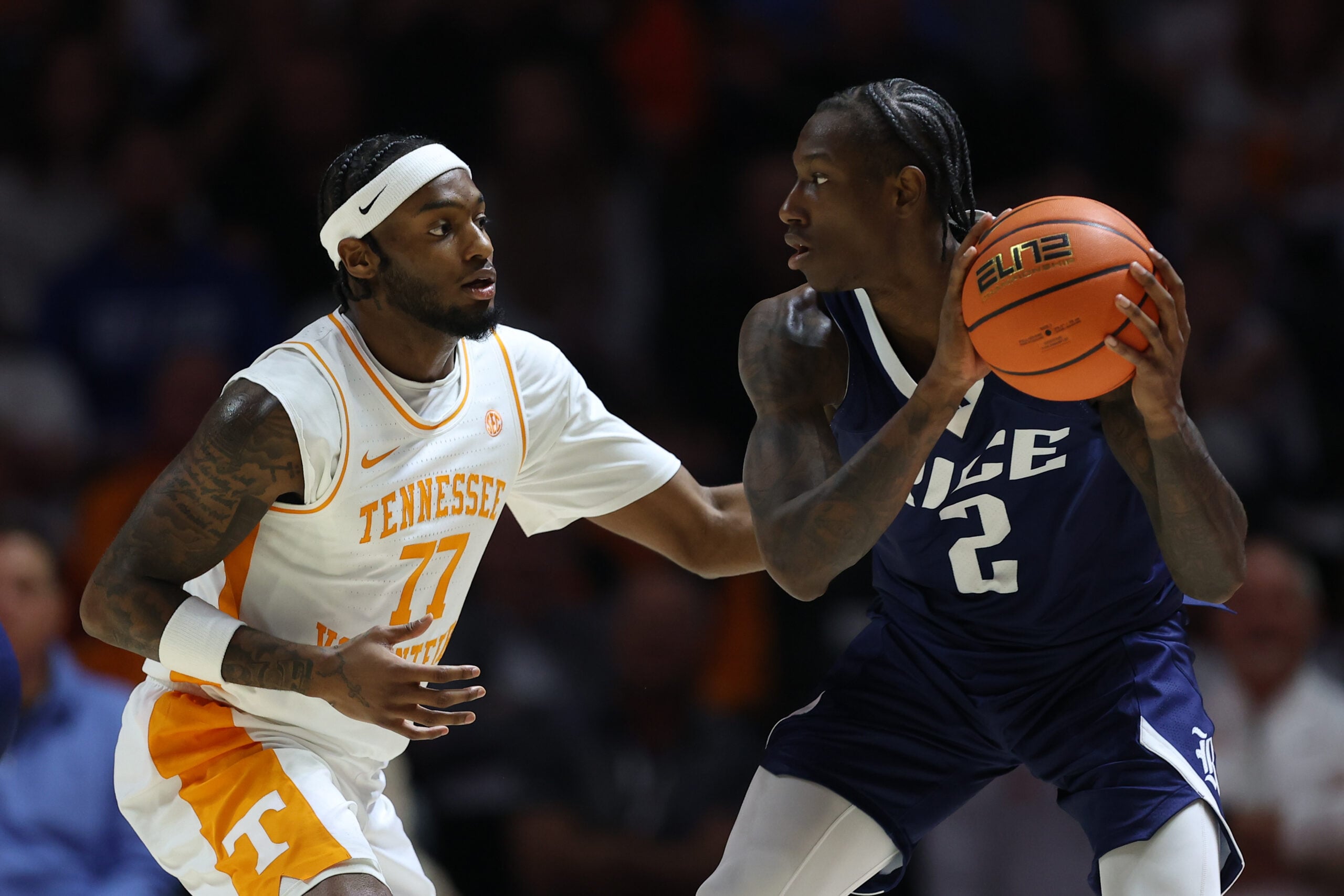 Nov 17, 2025; Knoxville, Tennessee, USA; Tennessee Volunteers guard Amaree Abram (77) defends Rice Owls guard Jalen Smith (2) during the first half at Thompson-Boling Arena at Food City Center. Mandatory Credit: Randy Sartin-Imagn Images