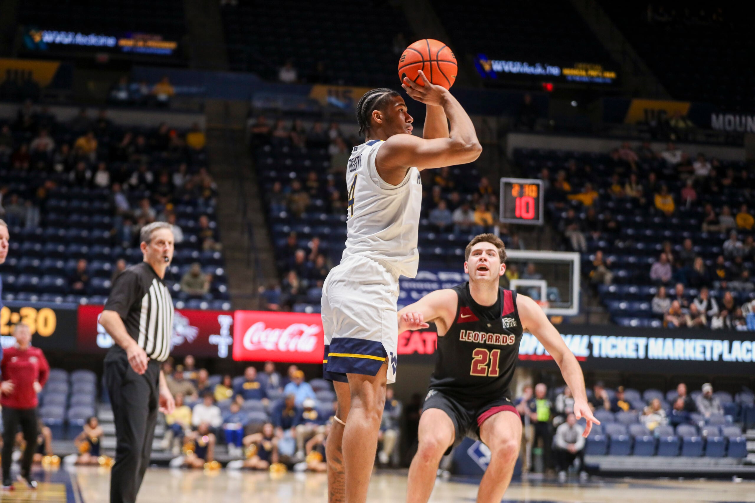 Nov 17, 2025; Morgantown, West Virginia, USA; West Virginia Mountaineers guard Jayden Forsythe (4) shoots a three-point basket during the second half against the Lafayette Leopards at WVU Coliseum. Mandatory Credit: Ben Queen-Imagn Images