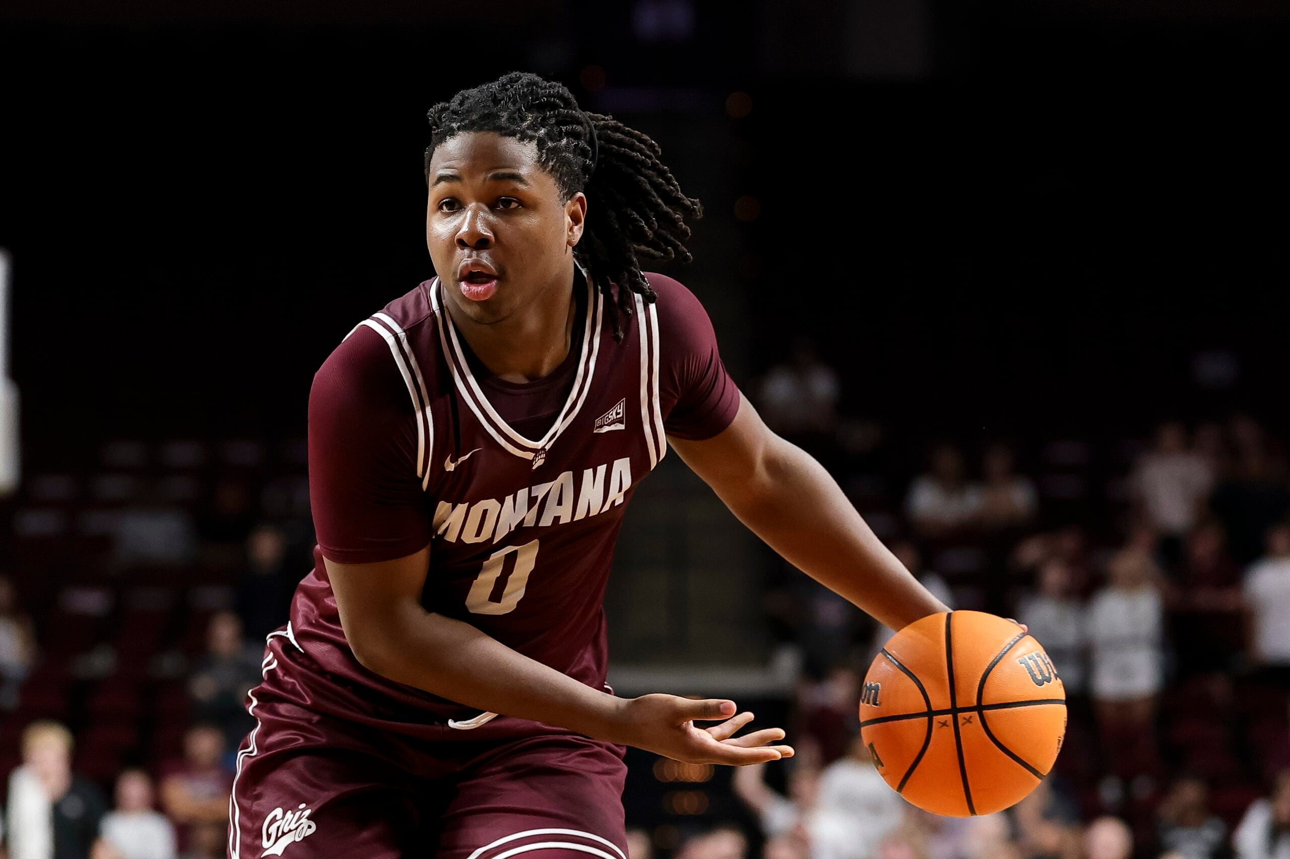Nov 18, 2025; College Station, Texas, USA; Montana Grizzlies guard Money Williams (0) looks to pass the ball during the second half against the Texas A&M Aggies at Reed Arena. Mandatory Credit: Maria Lysaker-Imagn Images