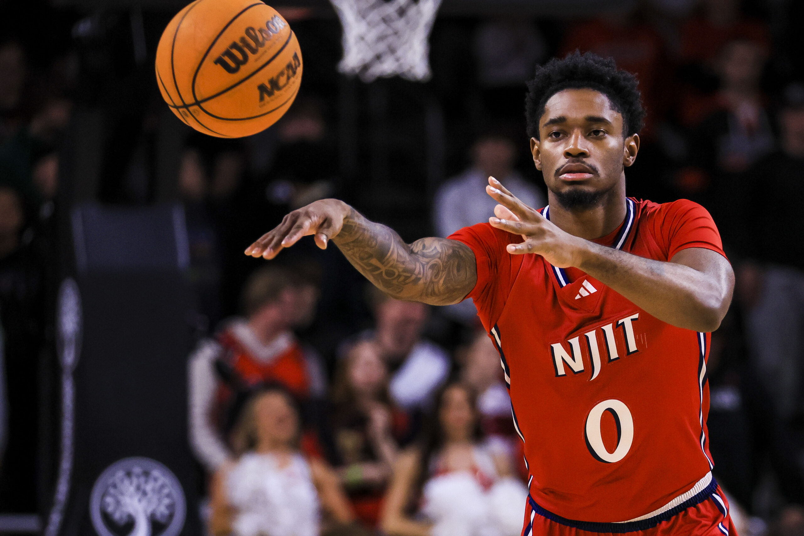 Nov 24, 2025; Cincinnati, Ohio, USA; NJIT Highlanders guard Sebastian Robinson (0) passes the ball against the Cincinnati Bearcats in the second half at Fifth Third Arena. Mandatory Credit: Katie Stratman-Imagn Images