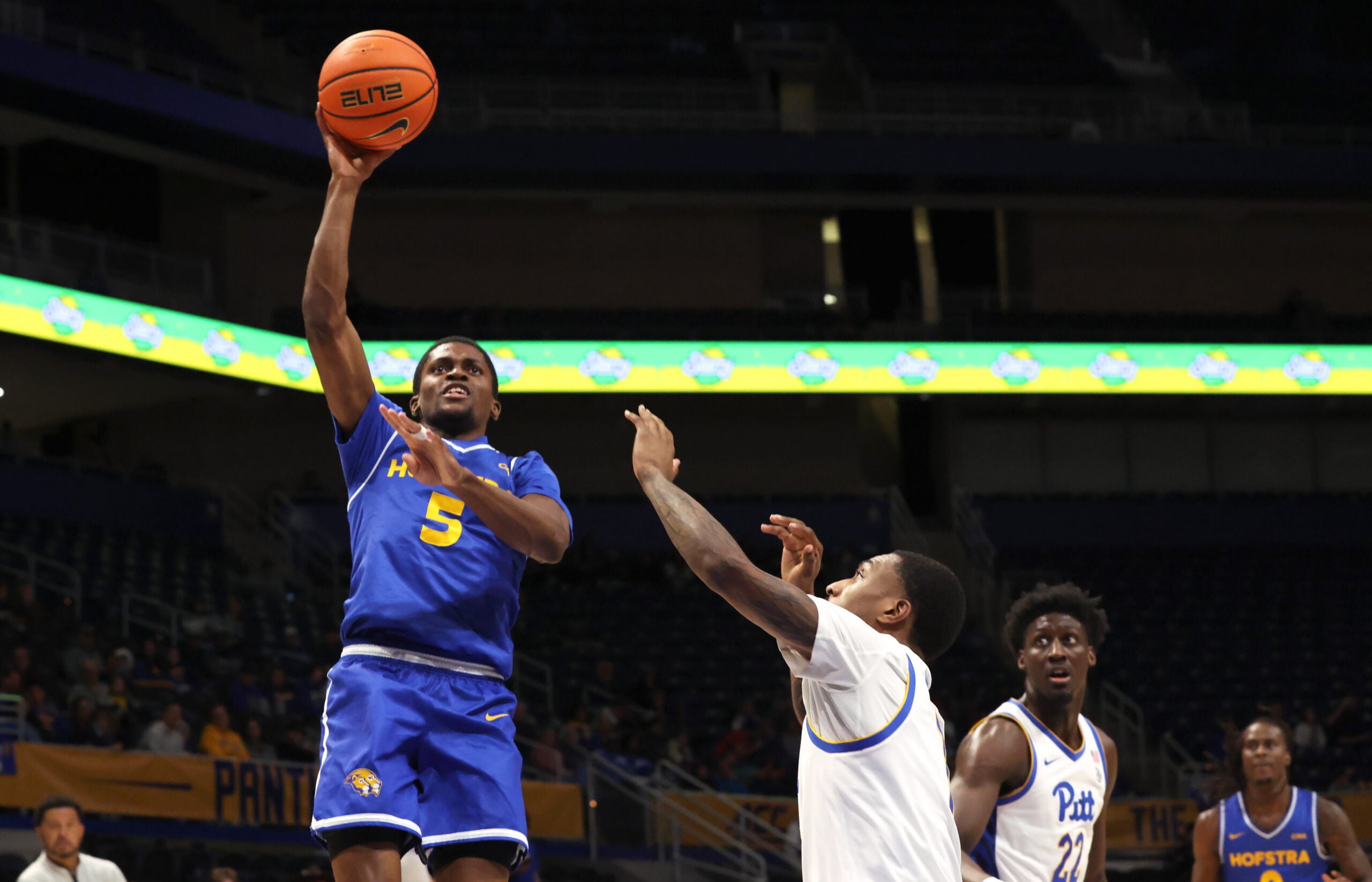 Dec 7, 2025; Pittsburgh, Pennsylvania, USA;  Hofstra Pride guard Cruz Davis (5) shoots over Pittsburgh Panthers guard Damarco Minor (right) during the first half against at the Petersen Events Center. Mandatory Credit: Charles LeClaire-Imagn Images