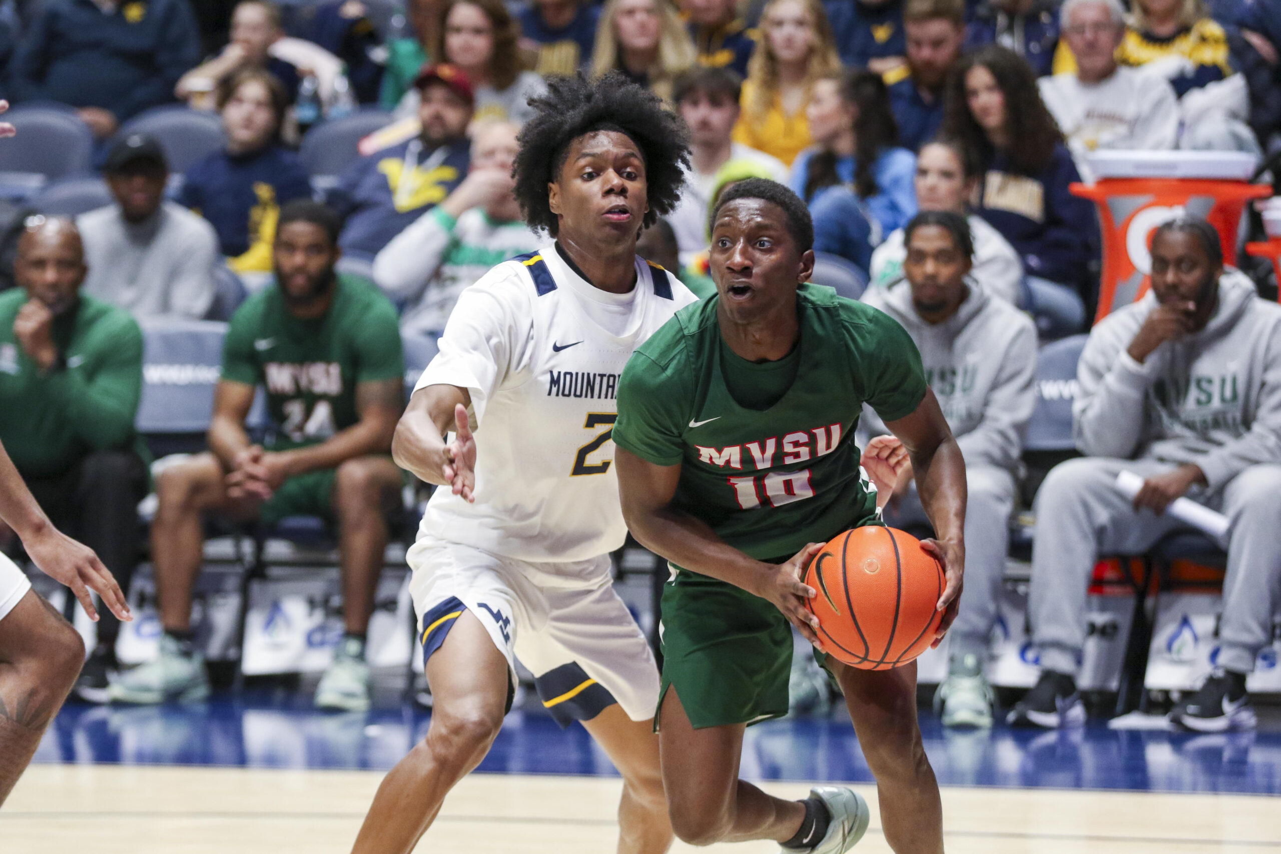 Dec 22, 2025; Morgantown, West Virginia, USA; Mississippi Valley State Delta Devils guard Michael James (10) drives baseline past West Virginia Mountaineers guard Amir Jenkins (2) during the second half at Hope Coliseum. Mandatory Credit: Ben Queen-Imagn Images