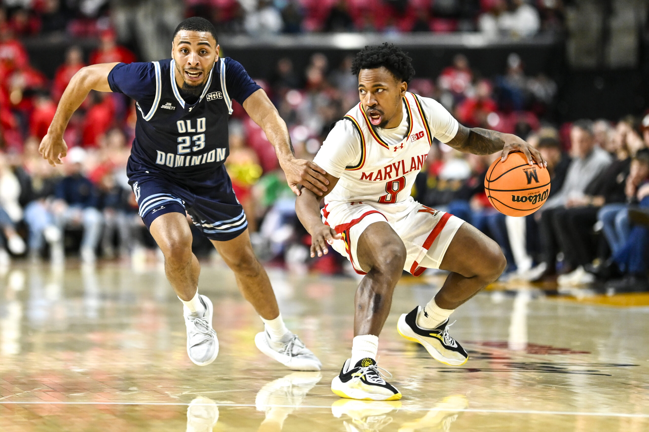 Dec 28, 2025; College Park, Maryland, USA; Maryland Terrapins guard David Coit (8) dribbles as Old Dominion Monarchs guard Jordan Battle (23) defends during the second half  at Xfinity Center. Mandatory Credit: Tommy Gilligan-Imagn Images