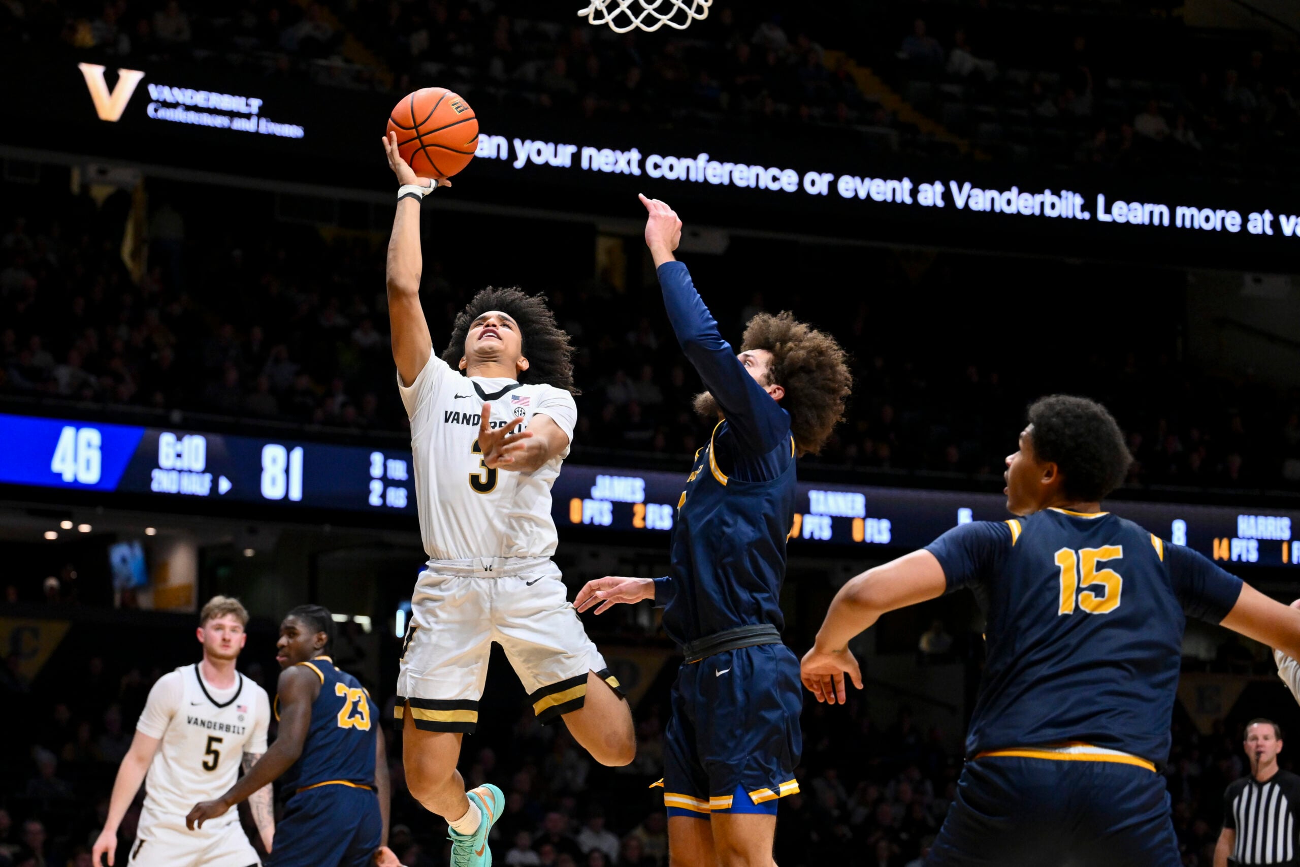 Dec 29, 2025; Nashville, Tennessee, USA;  Vanderbilt Commodores guard Tyler Tanner (3) shoots over New Haven Chargers guard Jabri Fitzpatrick (1) during the second half at Memorial Gymnasium. Mandatory Credit: Steve Roberts-Imagn Images