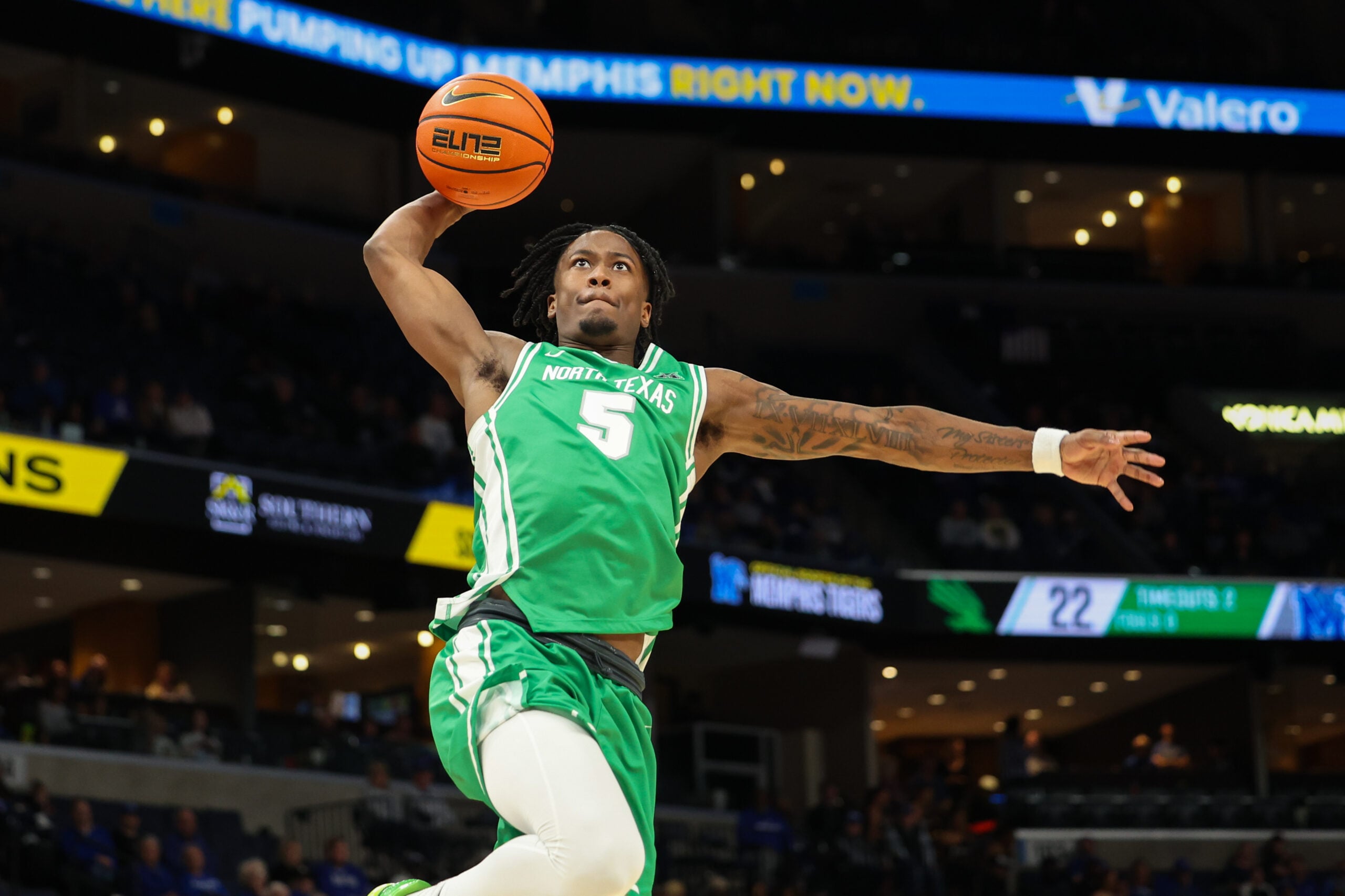 Dec 31, 2025; Memphis, Tennessee, USA; North Texas Mean Green guard David Terrell Jr. (5) dunks the ball against the Memphis Tigers during the second half at FedExForum. Mandatory Credit: Wesley Hale-Imagn Images