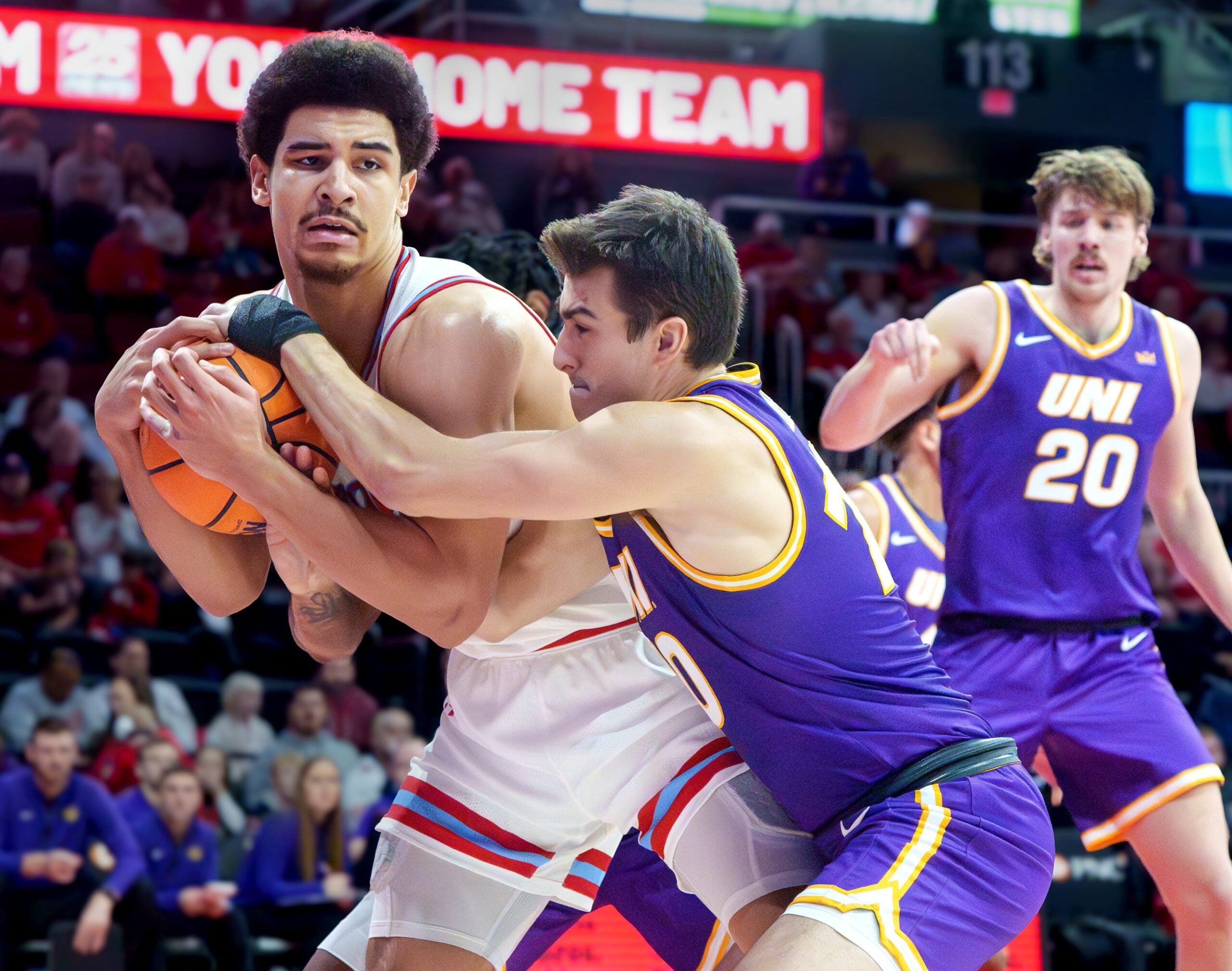 Bradley’s AJ Smith, left, tangles with Northern Iowa’s RJ Taylor in the first half of their college basketball game Saturday, Jan. 10, 2026 at Carver Arena in Peoria. The Braves defeated the Panthers 75-69.