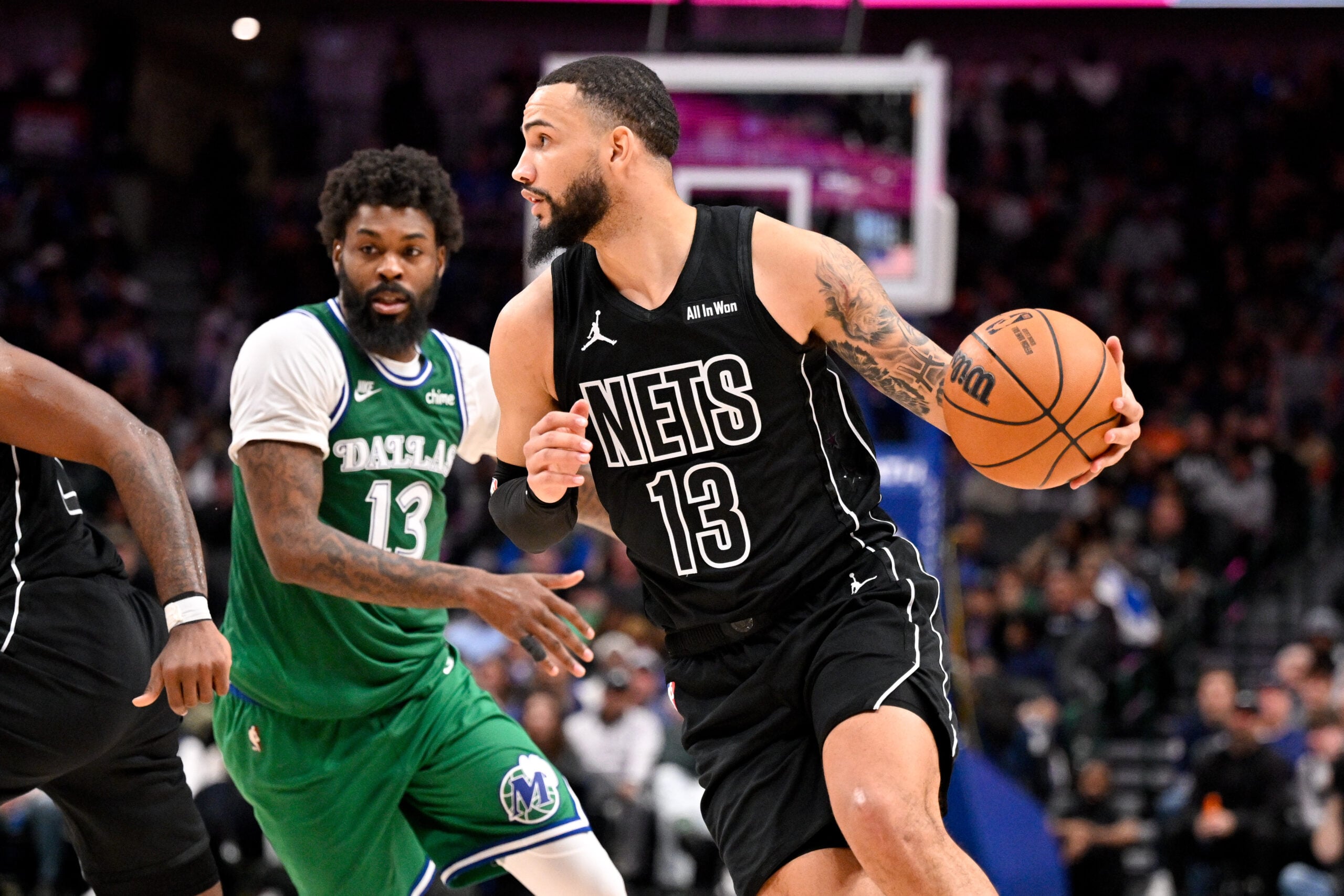 Jan 12, 2026; Dallas, Texas, USA; Brooklyn Nets guard Tyrese Martin (13) brings the ball up court past Dallas Mavericks forward Naji Marshall (13) during the second half at the American Airlines Center. Mandatory Credit: Jerome Miron-Imagn Images