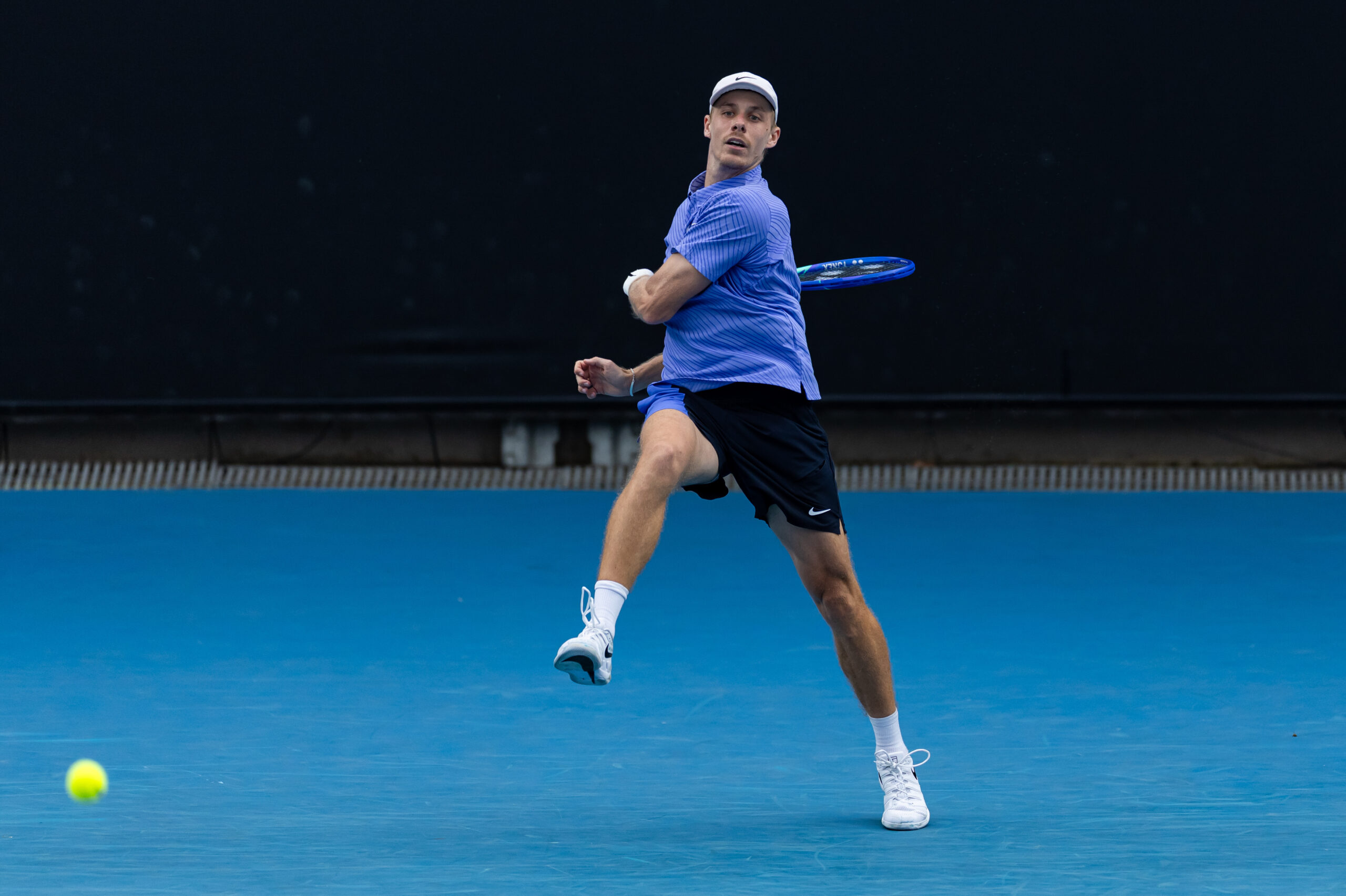 Jan 19, 2026; Melbourne, Victoria, Australia; Denis Shapovalov of Canada in action against Yunchaokete Bu of China in the first round of the men’s singles at the Australian Open at ANZ Arena in Melbourne Park. Mandatory Credit: Mike Frey-Imagn Images