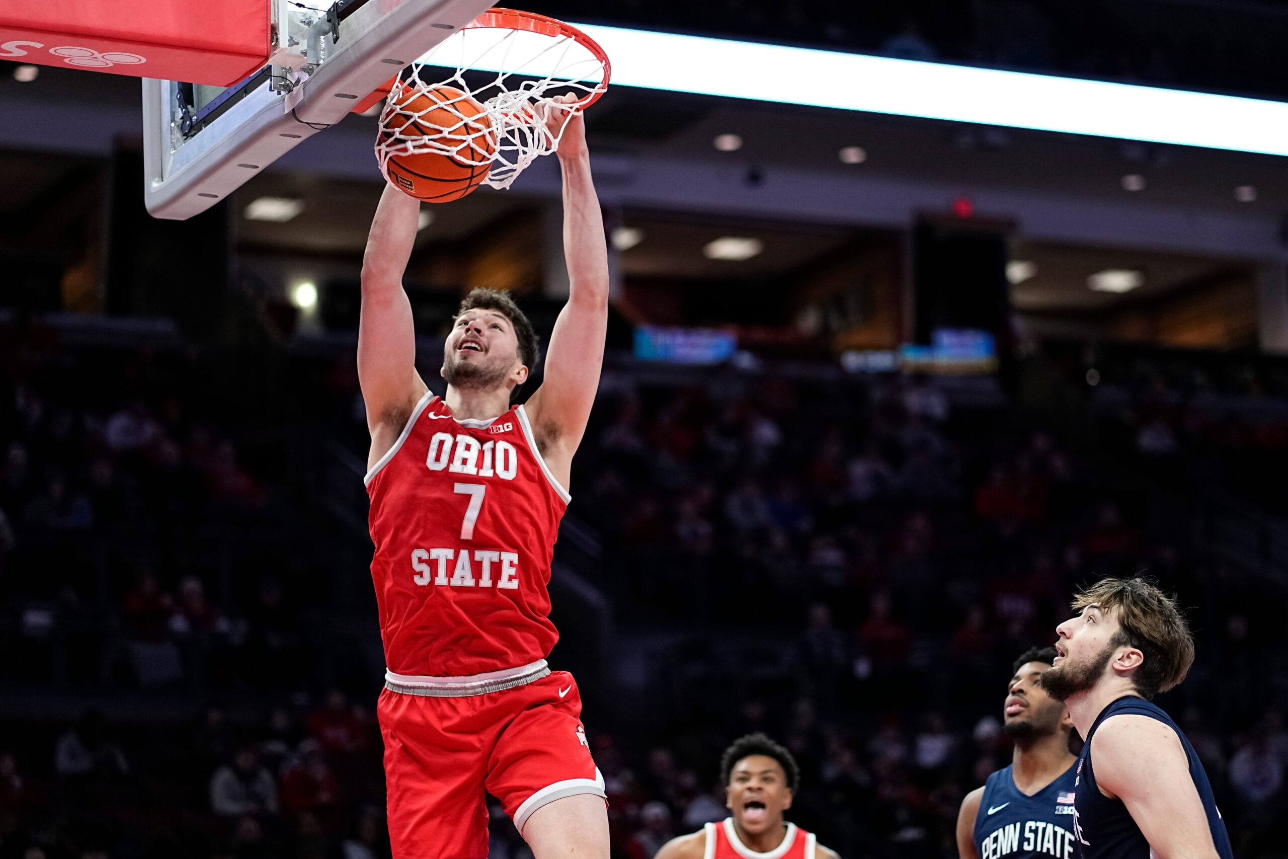 Ohio State Buckeyes center Ivan Njegovan (7) dunks over Penn State Nittany Lions forward Ivan Juric (3) during the second half of the NCAA men's basketball game at the Schottenstein Center in Columbus on Jan. 26, 2026. Ohio State won 84-78.