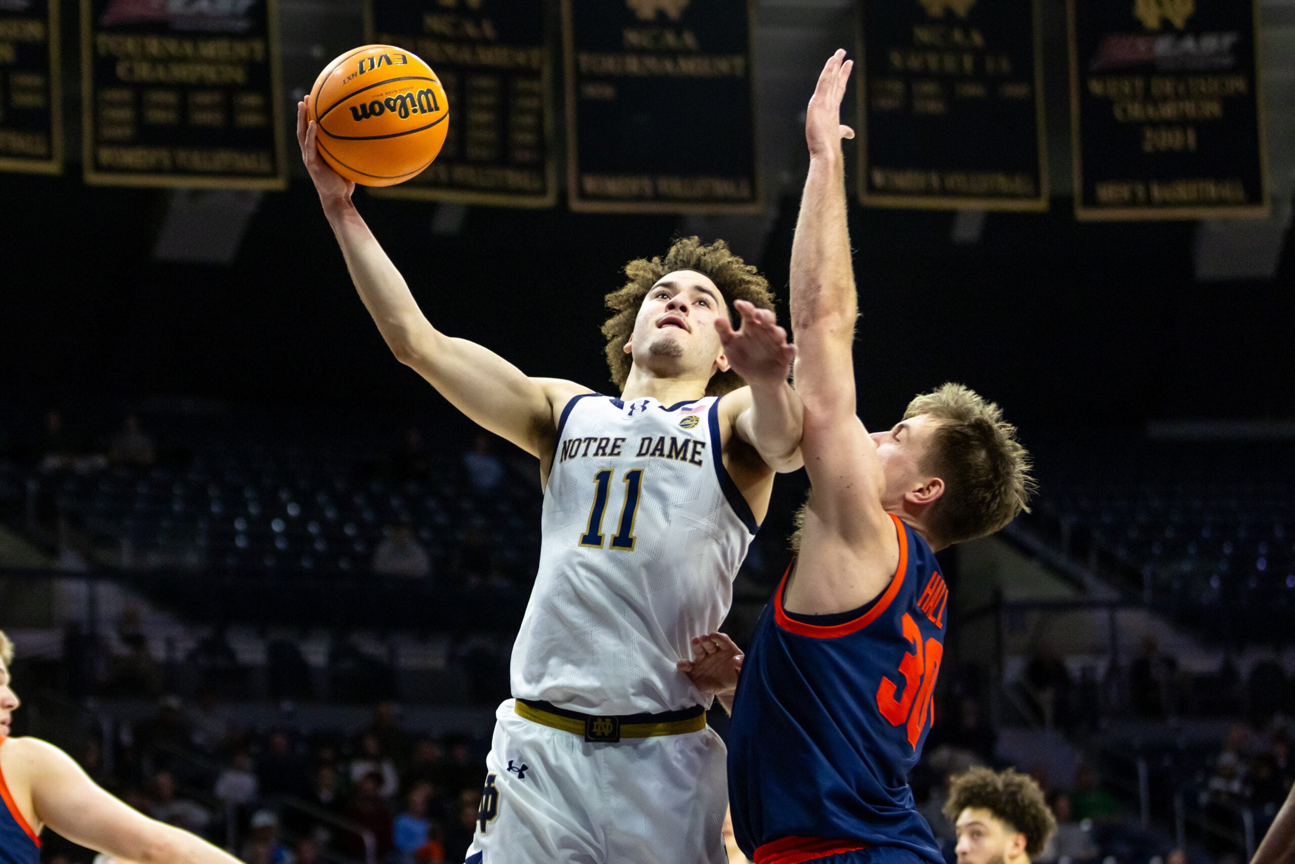 Jan 27, 2026; South Bend, Indiana, USA; Notre Dame Fighting Irish guard Braeden Shrewsberry (11) drives as Virginia Cavaliers guard Dallin Hall (30) defends during the first half at Purcell Pavilion at the Joyce Center. Mandatory Credit: Michael Caterina-Imagn Images