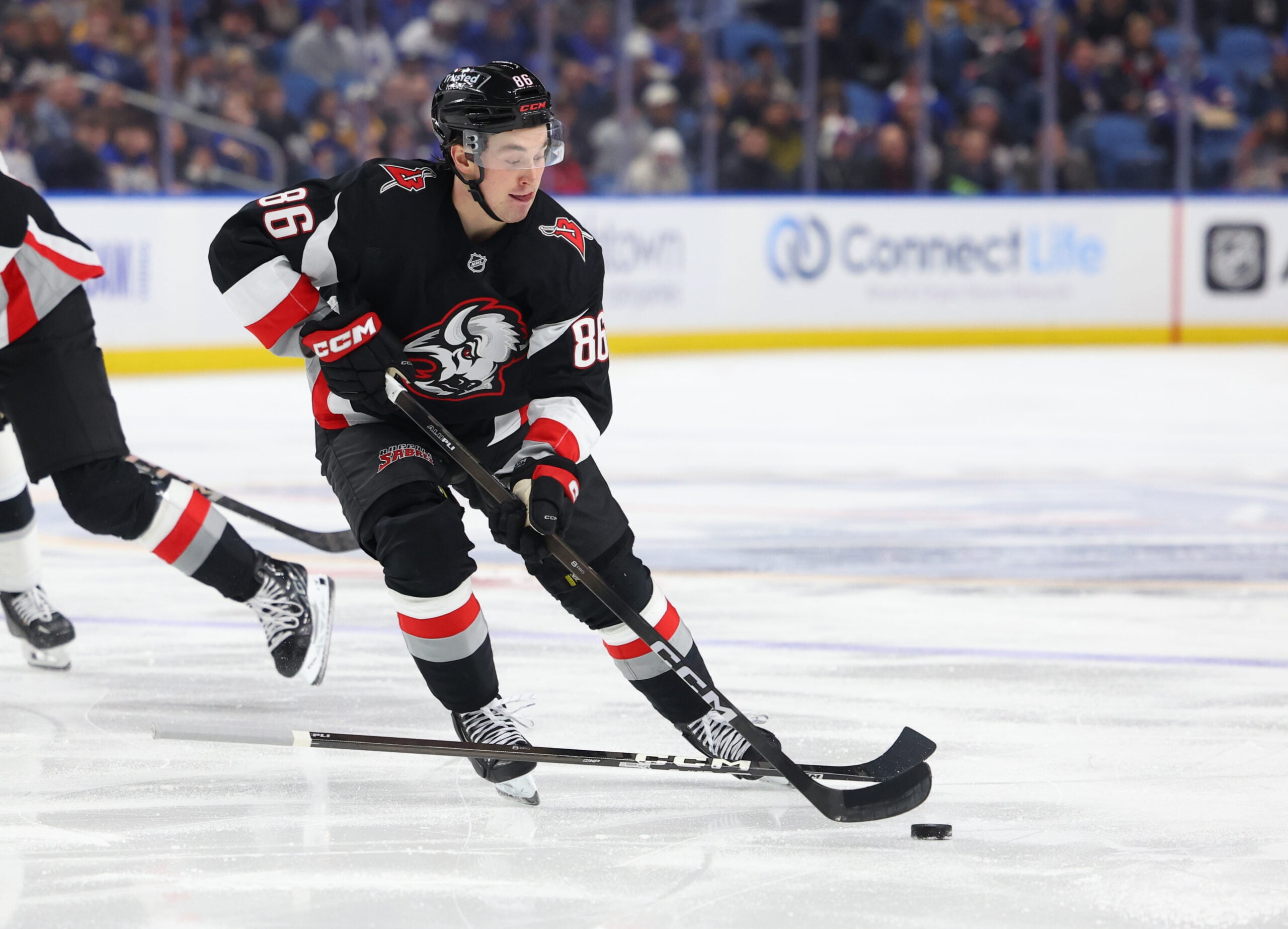 Jan 29, 2026; Buffalo, New York, USA;  Buffalo Sabres center Noah Ostlund (86) controls the puck during the second period against the Los Angeles Kings at KeyBank Center. Mandatory Credit: Timothy T. Ludwig-Imagn Images